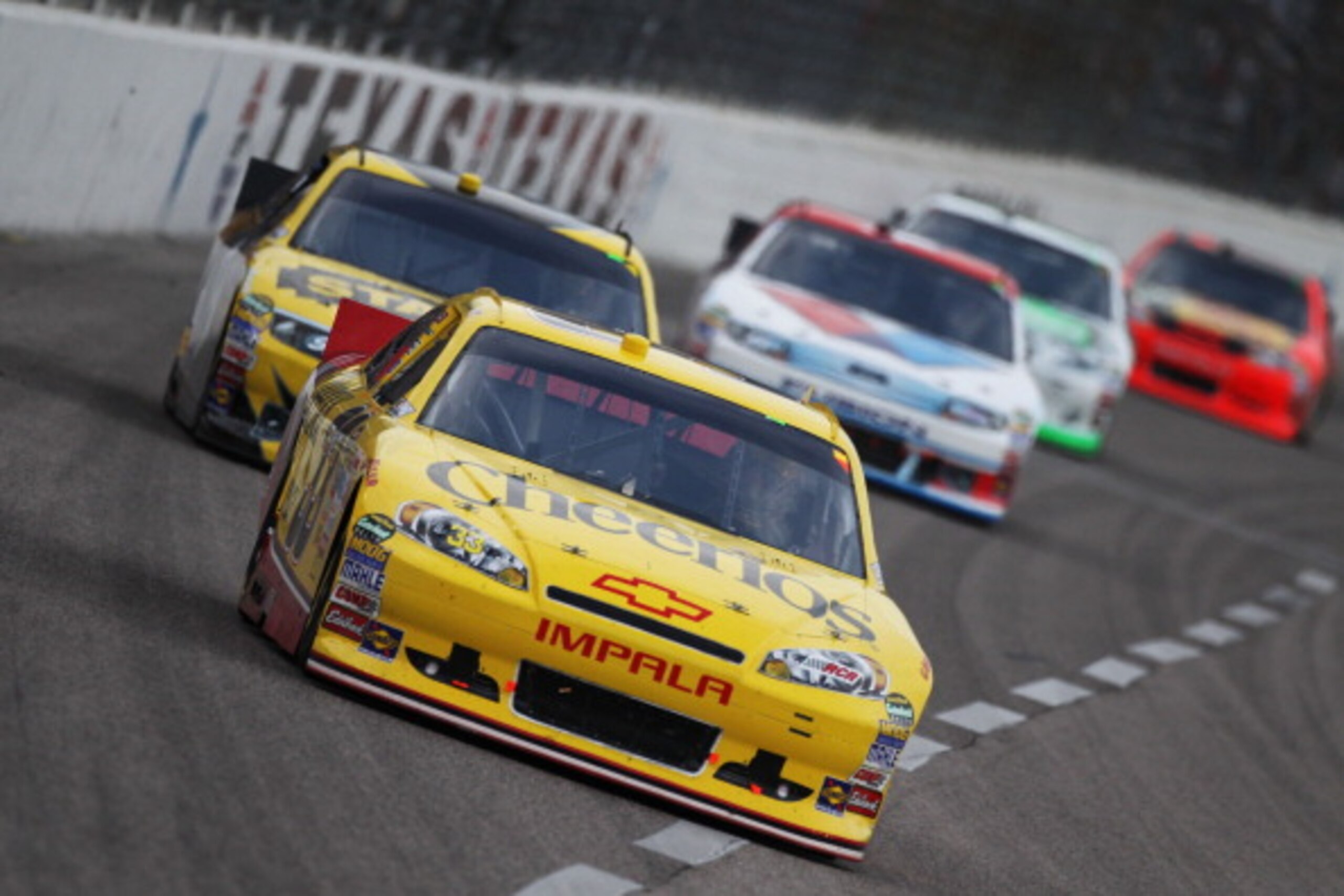 FORT WORTH, TX - APRIL 09:  Clint Bowyer, driver of the #33 Cheerios/Hamburger Helper Chevrolet, leads a group of cars during the NASCAR Sprint Cup Series Samsung Mobile 500 at Texas Motor Speedway on April 9, 2011 in Fort Worth, Texas.  (Photo by Jonatha