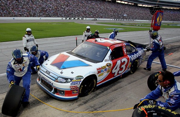 FORT WORTH, TX - APRIL 09:  A.J. Allmendinger pits the #43 Valvoline Ford during the NASCAR Sprint Cup Series Samsung Mobile 500 at Texas Motor Speedway on April 9, 2011 in Fort Worth, Texas.  (Photo by Jason Smith/Getty Images for NASCAR)