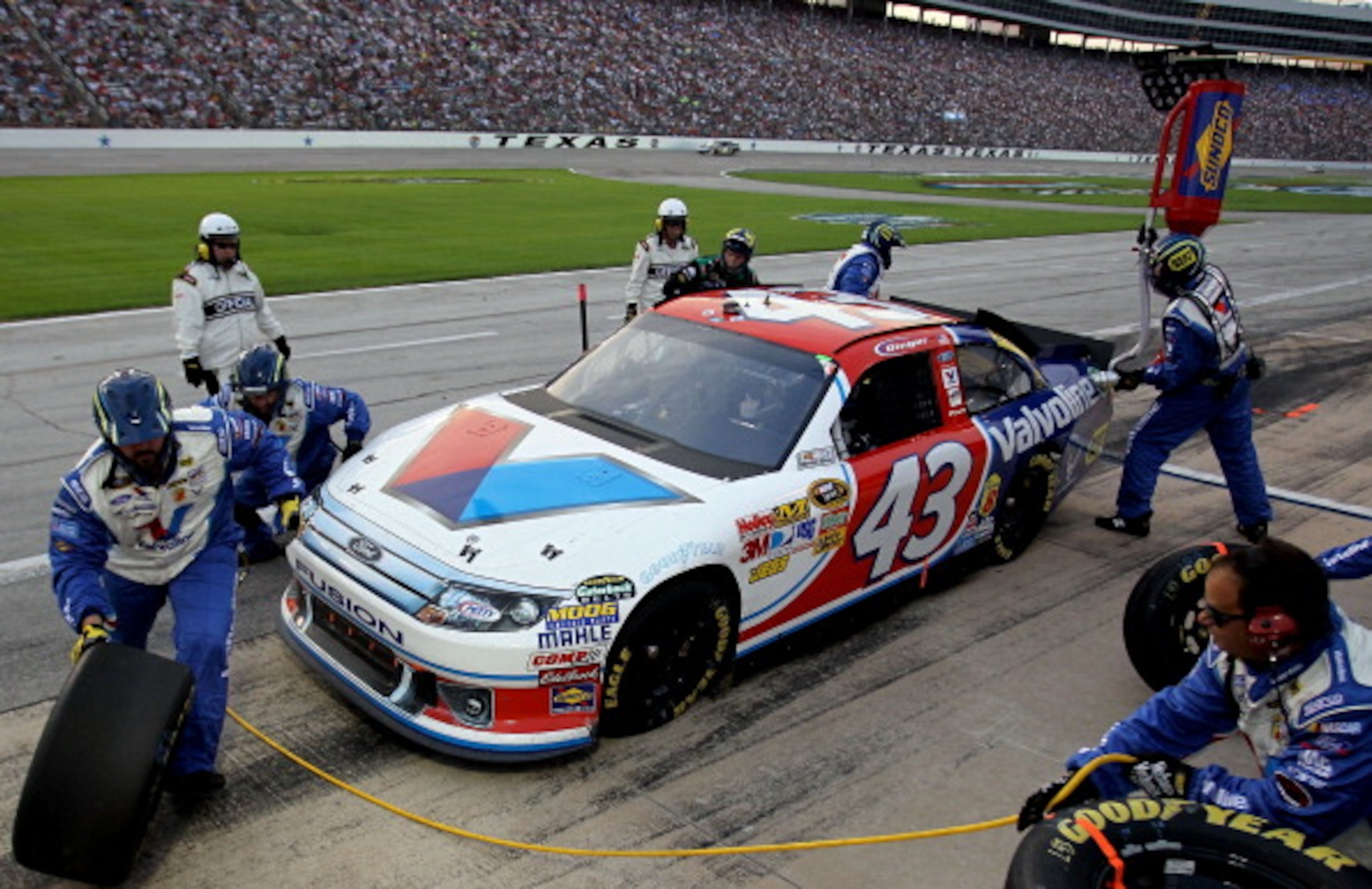 FORT WORTH, TX - APRIL 09:  A.J. Allmendinger pits the #43 Valvoline Ford during the NASCAR Sprint Cup Series Samsung Mobile 500 at Texas Motor Speedway on April 9, 2011 in Fort Worth, Texas.  (Photo by Jason Smith/Getty Images for NASCAR)