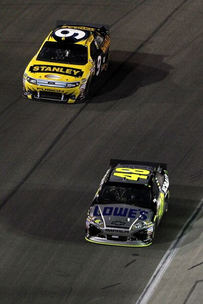 FORT WORTH, TX - APRIL 09:  Jimmie Johnson, driver of the #48 Lowe's Chevrolet, and Marcos Ambrose, driver of the #9 Stanley Ford, drive during the NASCAR Sprint Cup Series Samsung Mobile 500 at Texas Motor Speedway on April 9, 2011 in Fort Worth, Texas. 