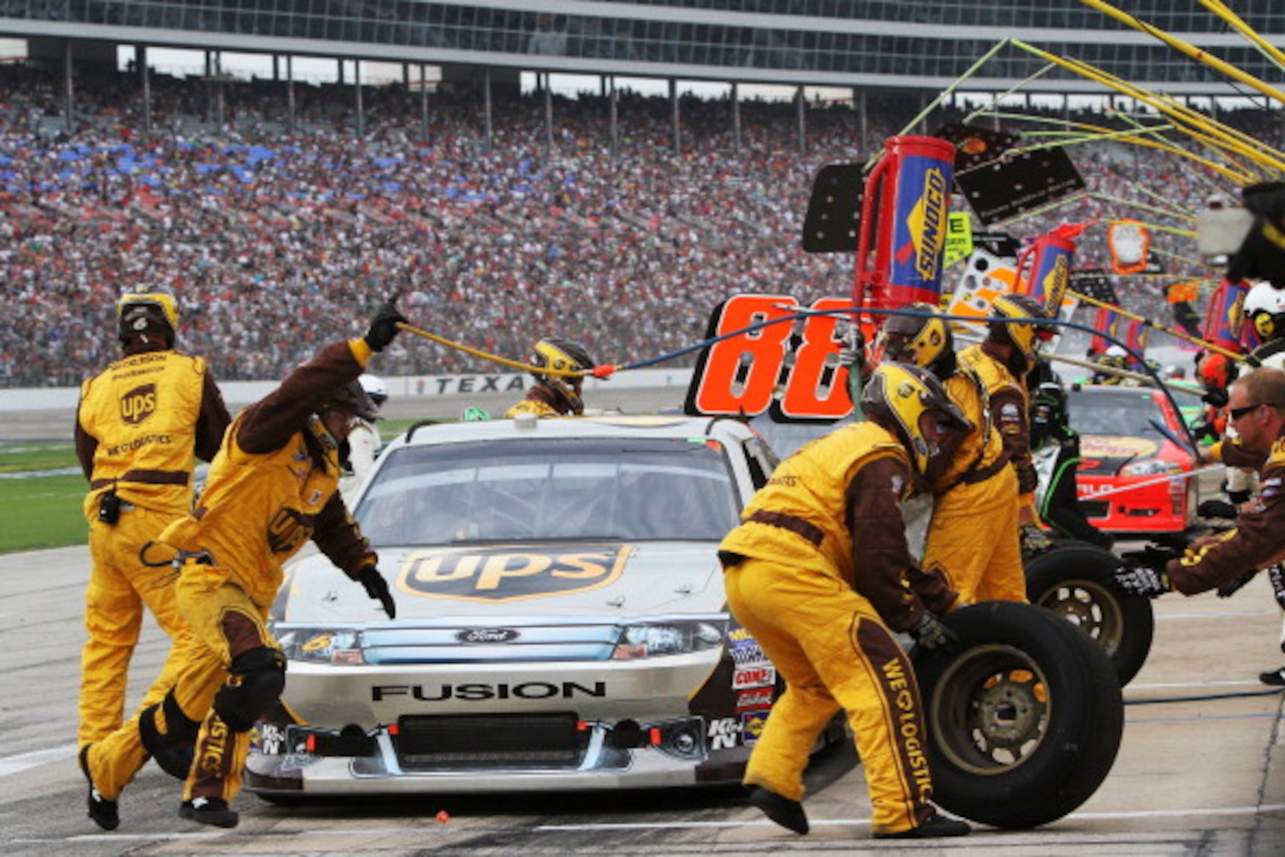 FORT WORTH, TX - APRIL 09:  David Ragan, driver of the #6 UPS Freight Ford, makes a pit stop during the NASCAR Sprint Cup Series Samsung Mobile 500 at Texas Motor Speedway on April 9, 2011 in Fort Worth, Texas.  (Photo by Jerry Markland/Getty Images for N