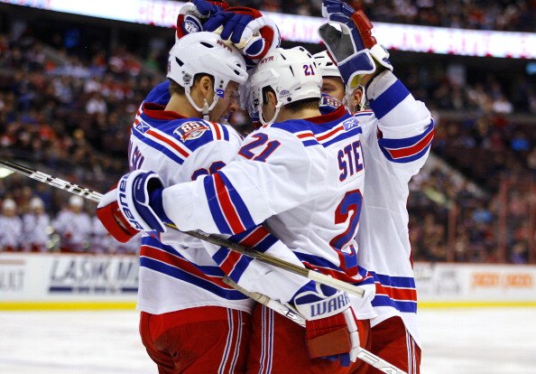 OTTAWA, CANADA - MARCH 04:  Derek Stepan #21 of the New York Rangers celebrates his goal against the Ottawa Senators with teammates Wojtek Wolski #86 and Steve Eminger #44 in a game at Scotiabank Place on March 4, 2011 in Ottawa, Ontario, Canada.  (Photo