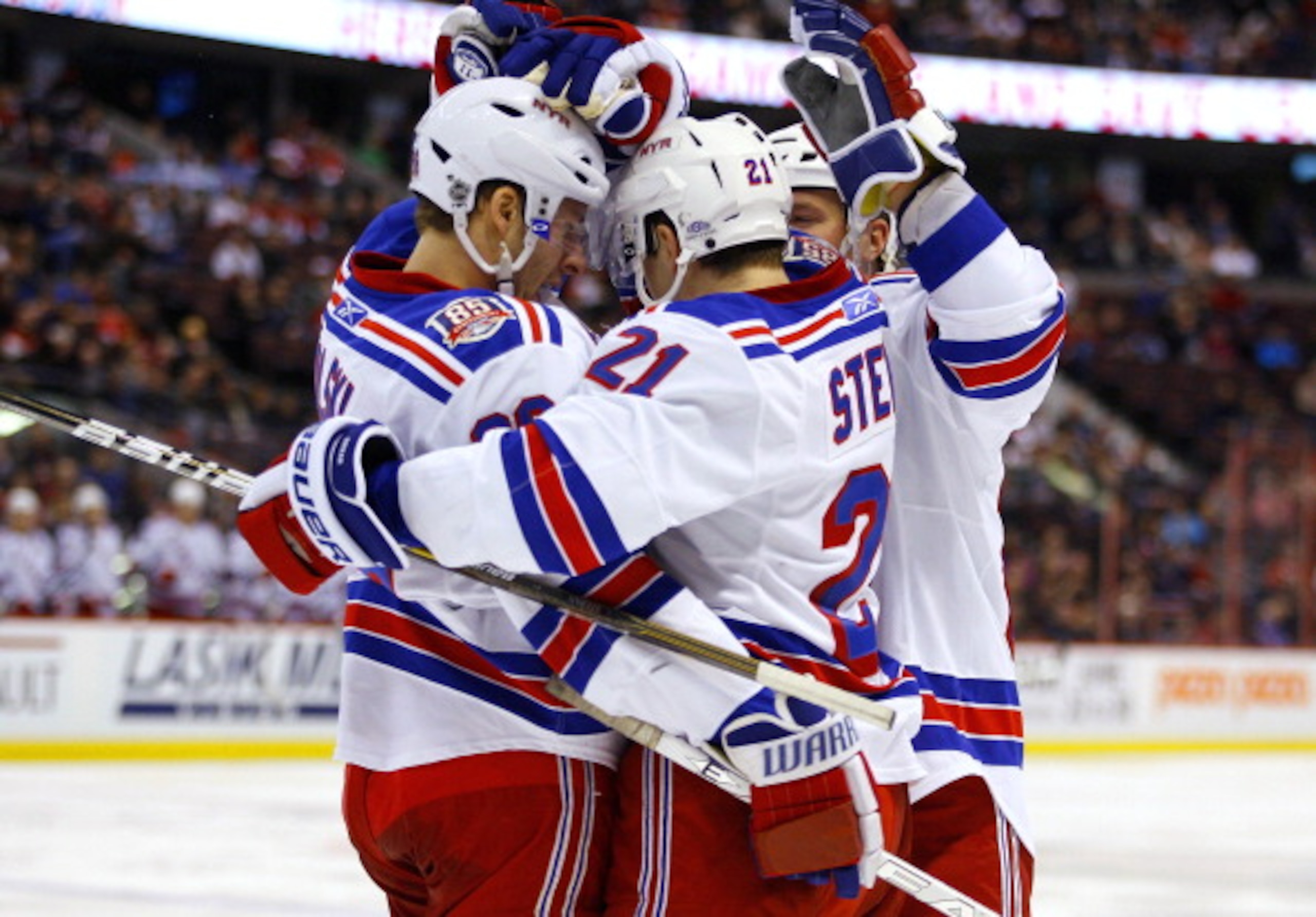 OTTAWA, CANADA - MARCH 04: Derek Stepan #21 of the New York Rangers celebrates his goal against the Ottawa Senators with teammates Wojtek Wolski #86 and Steve Eminger #44 in a game at Scotiabank Place on March 4, 2011 in Ottawa, Ontario, Canada. (Photo OTTAWA, CANADA - MARCH 04: Derek Stepan #21 of the New York Rangers celebrates his goal against the Ottawa Senators with teammates Wojtek Wolski #86 and Steve Eminger #44 in a game at Scotiabank Place on March 4, 2011 in Ottawa, Ontario, Canada. (Photo