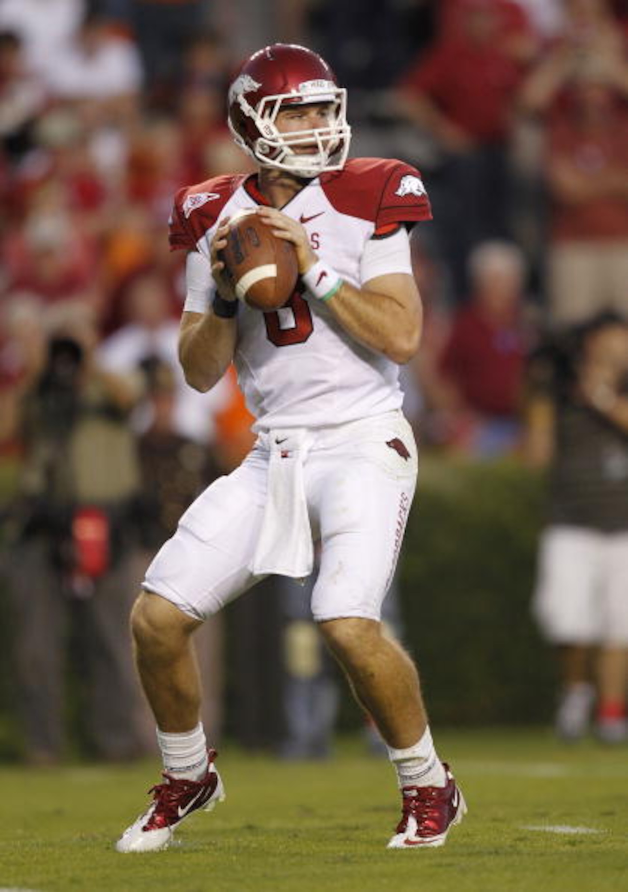AUBURN - OCTOBER 16:  Quarterback Tyler Wilson #8 of the Arkansas Razorbacks drops back and looks downfield for receiver during the game against the Auburn Tigers at Jordan-Hare Stadium on October 16, 2010 in Auburn, Alabama.  The Tigers beat the Razorbac