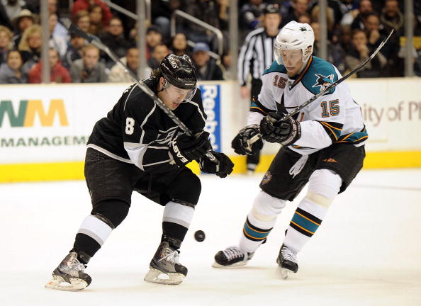 LOS ANGELES, CA - JANUARY 19:  Dany Heatley #15 of the San Jose Sharks is checked by Drew Doughty #8 of the Los Angeles Kings at Staples Center on January 19, 2010 in Los Angeles, California.  (Photo by Harry How/Getty Images)