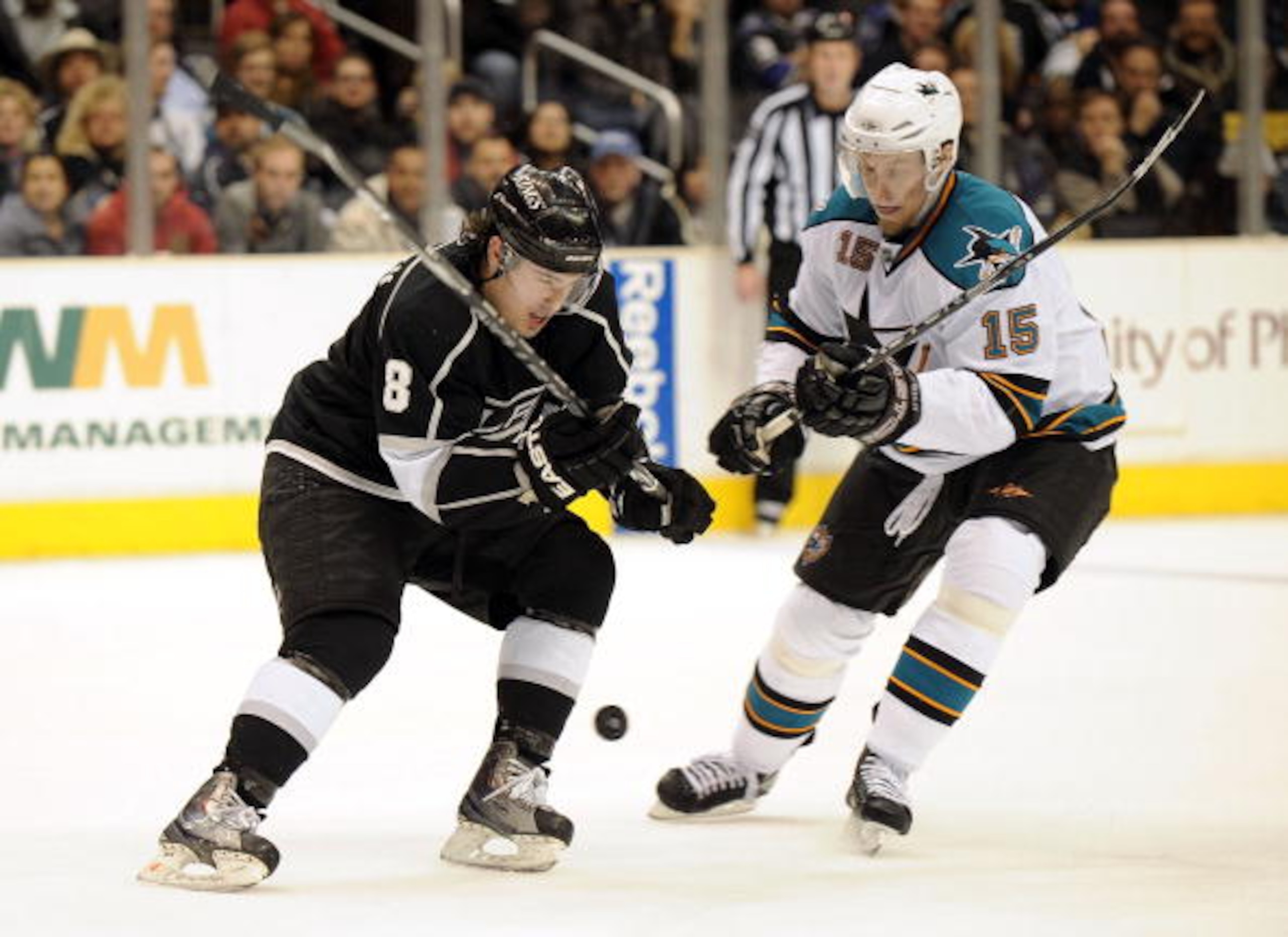 LOS ANGELES, CA - JANUARY 19:  Dany Heatley #15 of the San Jose Sharks is checked by Drew Doughty #8 of the Los Angeles Kings at Staples Center on January 19, 2010 in Los Angeles, California.  (Photo by Harry How/Getty Images)