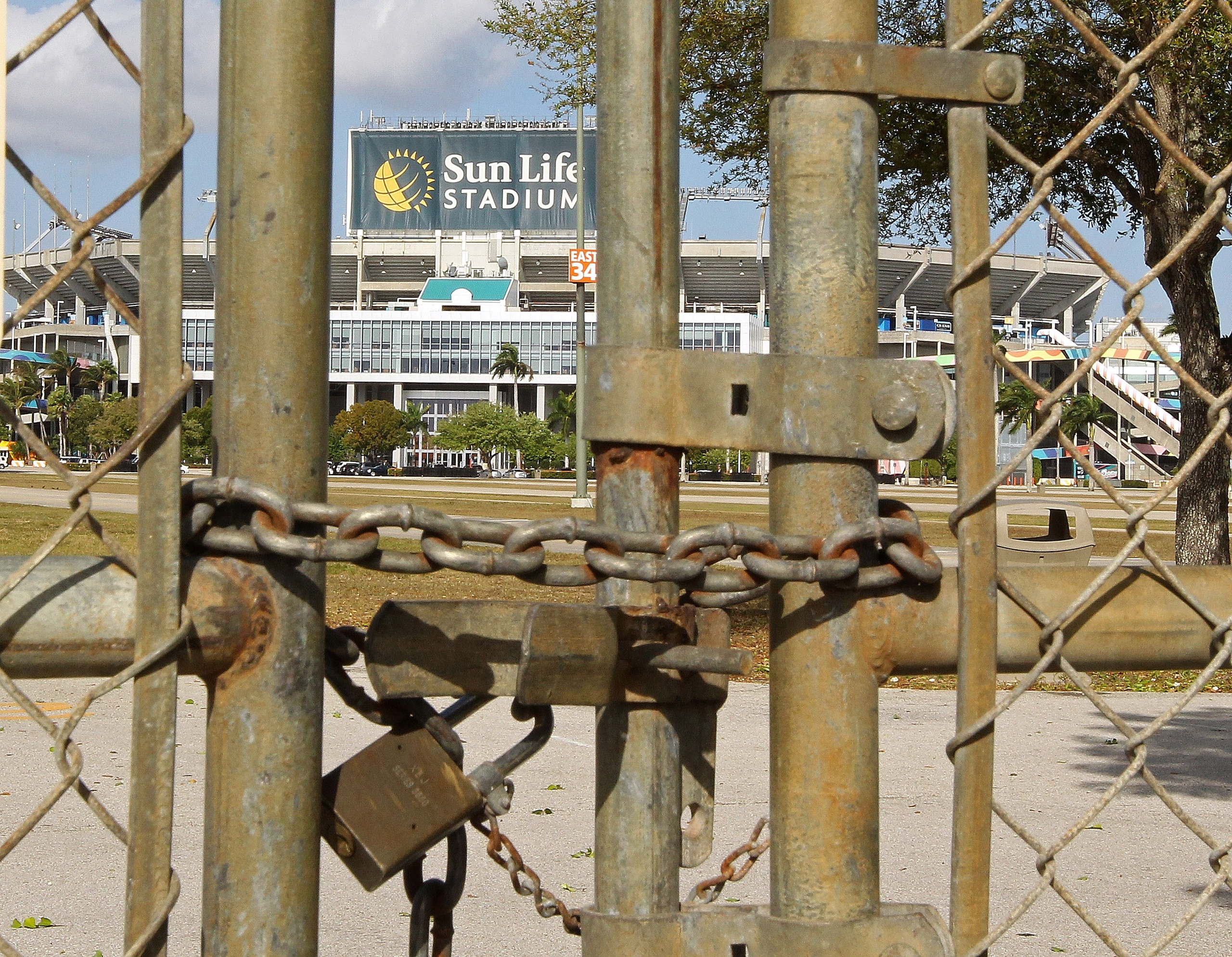 MIAMI GARDENS, FL - MARCH 03:  A view of Sun Life Stadium behind a locked gate as the NFL lockout looms on March 3, 2011 in Miami Gardens, Florida.  (Photo by Mike Ehrmann/Getty Images)
