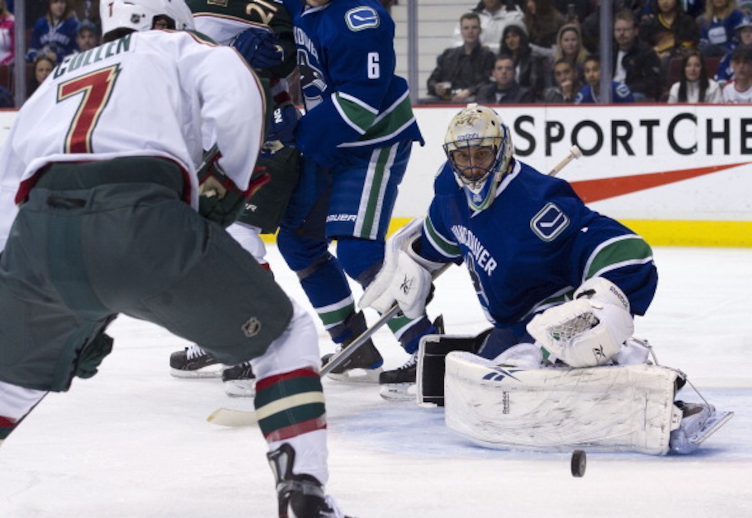 VANCOUVER, CANADA - APRIL 7: Goalie Roberto Luongo #1of the Vancouver Canucks keeps an eye on the loose puck after stopping Matt Cullen #7 of the Minnesota Wild in close during the first period in NHL action on April 07, 2011 at Rogers Arena in Vancouver, VANCOUVER, CANADA - APRIL 7: Goalie Roberto Luongo #1of the Vancouver Canucks keeps an eye on the loose puck after stopping Matt Cullen #7 of the Minnesota Wild in close during the first period in NHL action on April 07, 2011 at Rogers Arena in Vancouver,