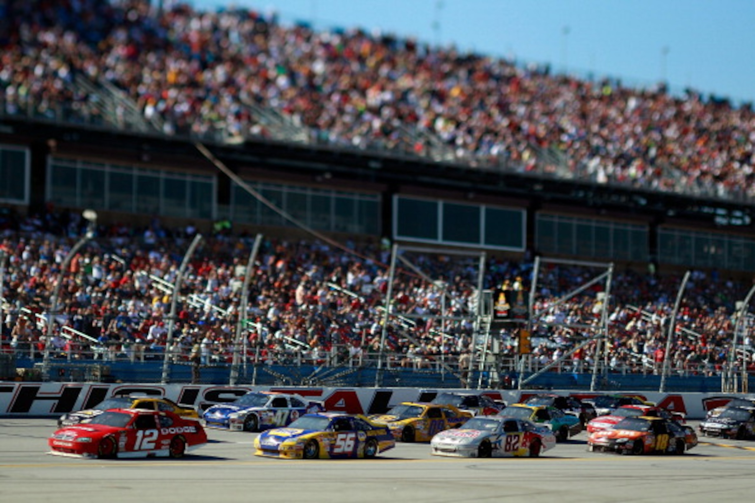 TALLADEGA, AL - OCTOBER 31:  (***EDITORS NOTE*** - THIS DIGITAL IMAGE WAS CREATED WITH THE USE OF VARIABLE FOCAL PLANE LENS)  Brad Keselowski, driver of the #12 Penske Dodge, leads a pack of cars during the NASCAR Sprint Cup Series AMP Energy Juice 500 at
