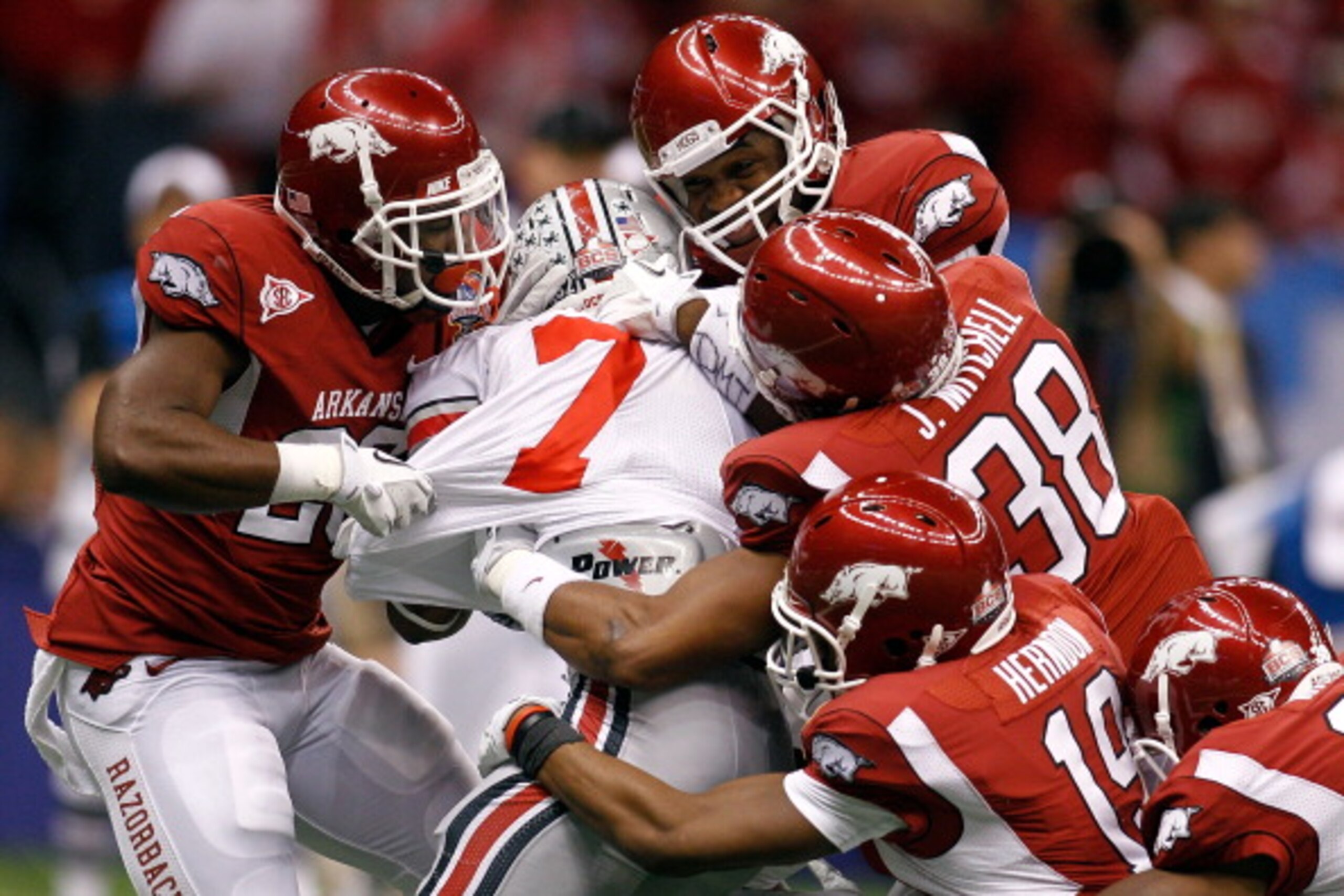 NEW ORLEANS, LA - JANUARY 04:  Jordan Hall #7 of the Ohio State Buckeyes is tackled by five Arkansas Razorbacks defenders in the fourth quarter during the Allstate Sugar Bowl at the Louisiana Superdome on January 4, 2011 in New Orleans, Louisiana.  (Photo