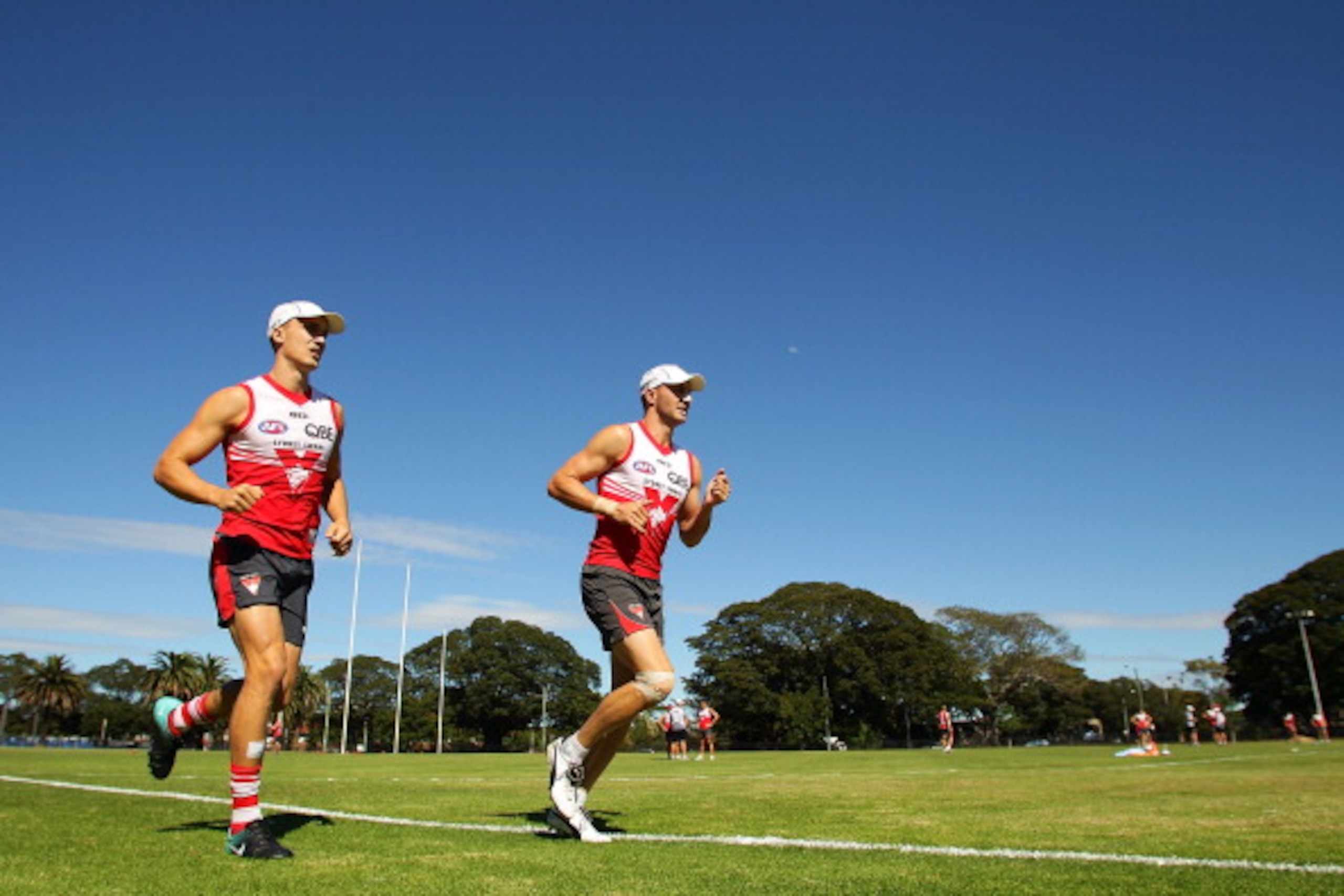 SYDNEY, AUSTRALIA - MARCH 25:  Ted Richards (L) and Tadhg Kennelly (R) jog during a Sydney Swans AFL training session at Moore Park on March 25, 2011 in Sydney, Australia.  (Photo by Matt King/Getty Images)