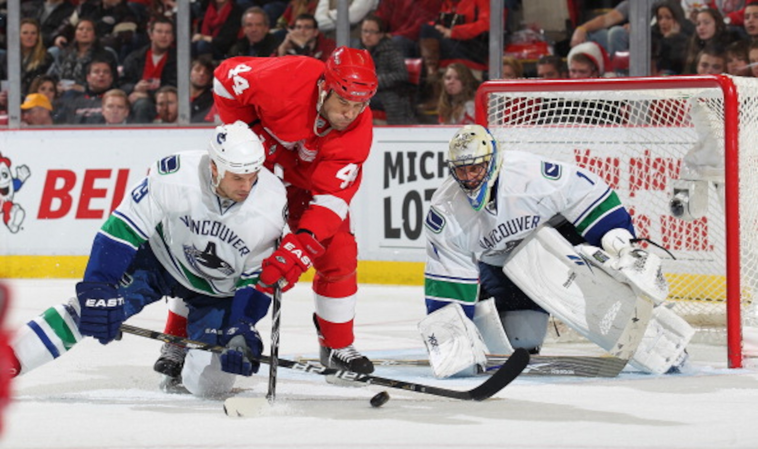 DETROIT, MI - DECEMBER 22: Roberto Luongo #1 and Aaron Rome #29 of the Vancouver Canucks stop a scoring attempt by Todd Bertuzzi #44 of the Detroit Red Wings on December 22, 2010 at the Joe Louis Arena in Detroit, Michigan. The Wings defeated the Canuck DETROIT, MI - DECEMBER 22: Roberto Luongo #1 and Aaron Rome #29 of the Vancouver Canucks stop a scoring attempt by Todd Bertuzzi #44 of the Detroit Red Wings on December 22, 2010 at the Joe Louis Arena in Detroit, Michigan. The Wings defeated the Canuck