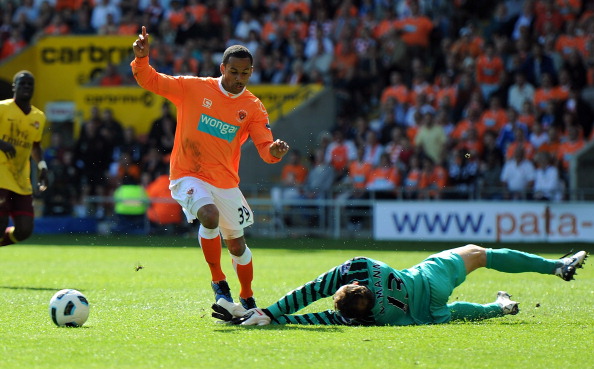 BLACKPOOL, ENGLAND - APRIL 10:  Jens Lehmann of Arsenal brings down DJ Campbell of Blackpool during the Barclays Premier League match between Blackpool and Arsenal at Bloomfield Road on April 10, 2011 in Blackpool, England.  (Photo by Chris Brunskill/Gett