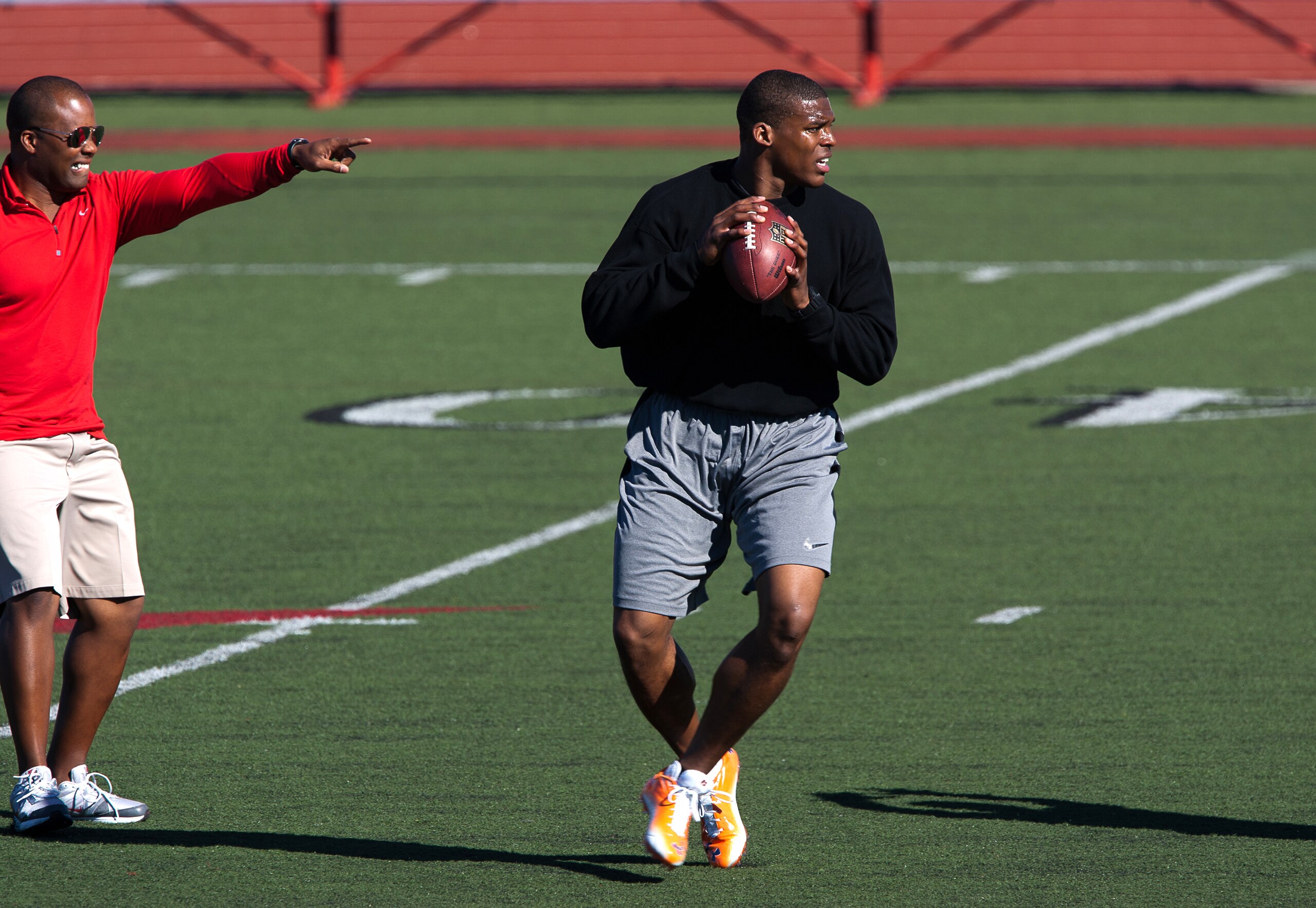 SAN DIEGO, CA - FEBRUARY 10: 2010 Heisman Trophy winning quarterback Cam Newton of Auburn throws the ball during his workout routine for the media at Cathedral High School's sports stadium on February 10, 2011 in San Diego, California. (Photo by Kent Horn SAN DIEGO, CA - FEBRUARY 10: 2010 Heisman Trophy winning quarterback Cam Newton of Auburn throws the ball during his workout routine for the media at Cathedral High School's sports stadium on February 10, 2011 in San Diego, California. (Photo by Kent Horn