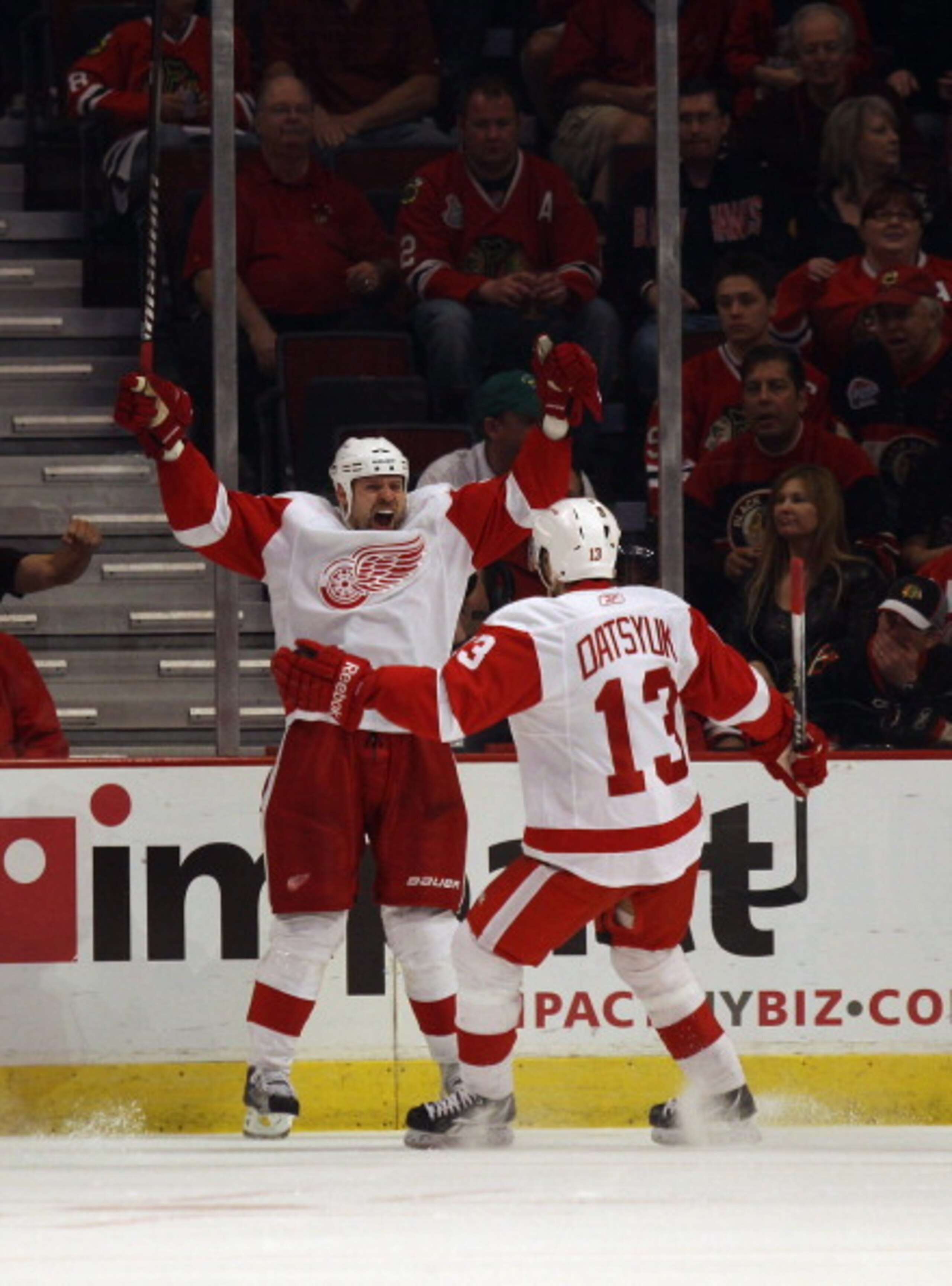 CHICAGO, IL - APRIL 10: Tomas Holmstrom #96 of the Detroit Red Wings celebrates a 2nd period goal with teammate Pavel Datsyuk #13 against the Chicago Blackhawks at the United Center on April 10, 2011 in Chicago, Illinois. (Photo by Jonathan Daniel/Getty I