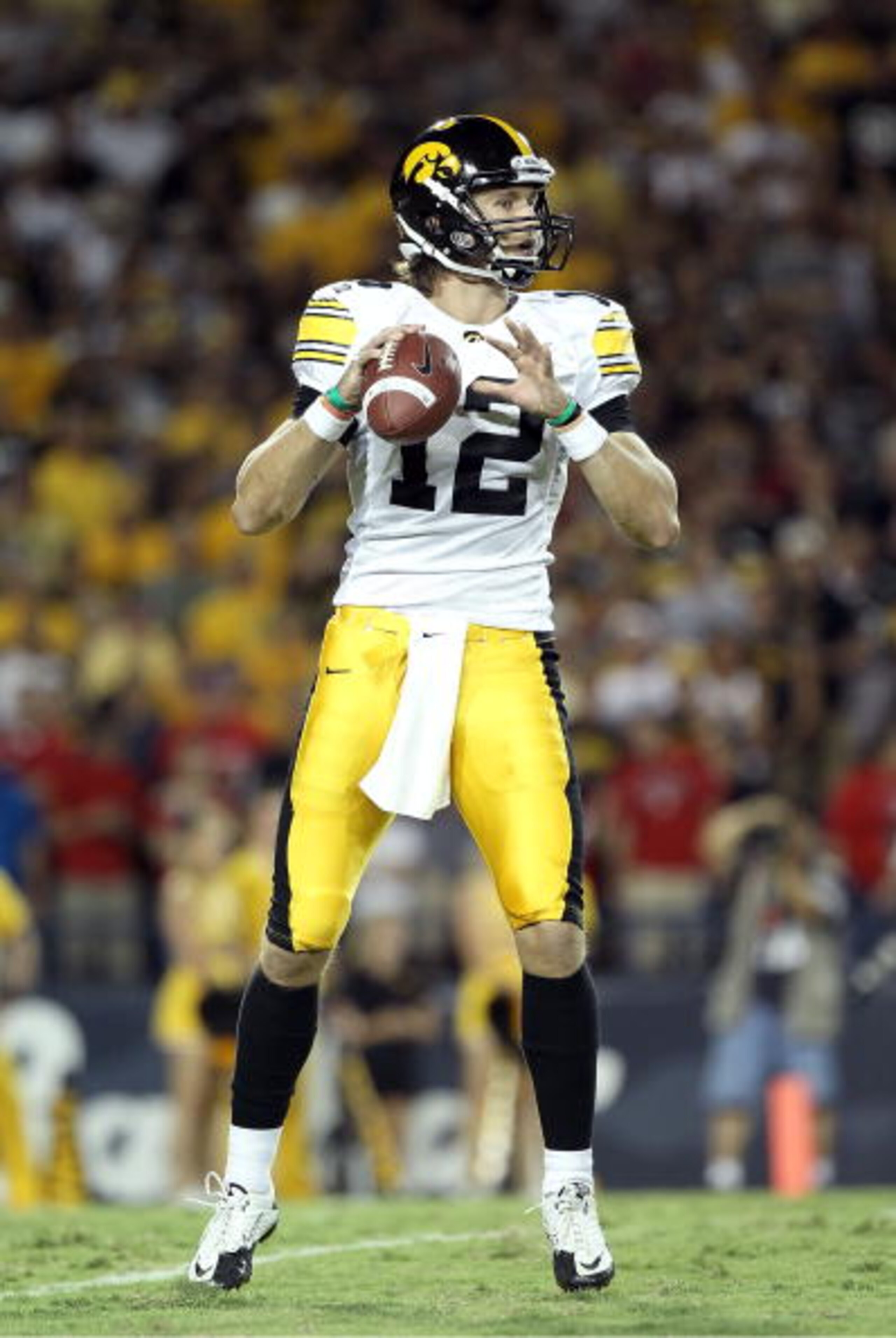 TUCSON, AZ - SEPTEMBER 18: Quarterback Ricky Stanzi #12 of the Iowa Hawkeyes in action during the college football game against the Arizona Wildcats at Arizona Stadium on September 18, 2010 in Tucson, Arizona. The Wildcats defeated the Hawkeyes 34-27. TUCSON, AZ - SEPTEMBER 18: Quarterback Ricky Stanzi #12 of the Iowa Hawkeyes in action during the college football game against the Arizona Wildcats at Arizona Stadium on September 18, 2010 in Tucson, Arizona. The Wildcats defeated the Hawkeyes 34-27.