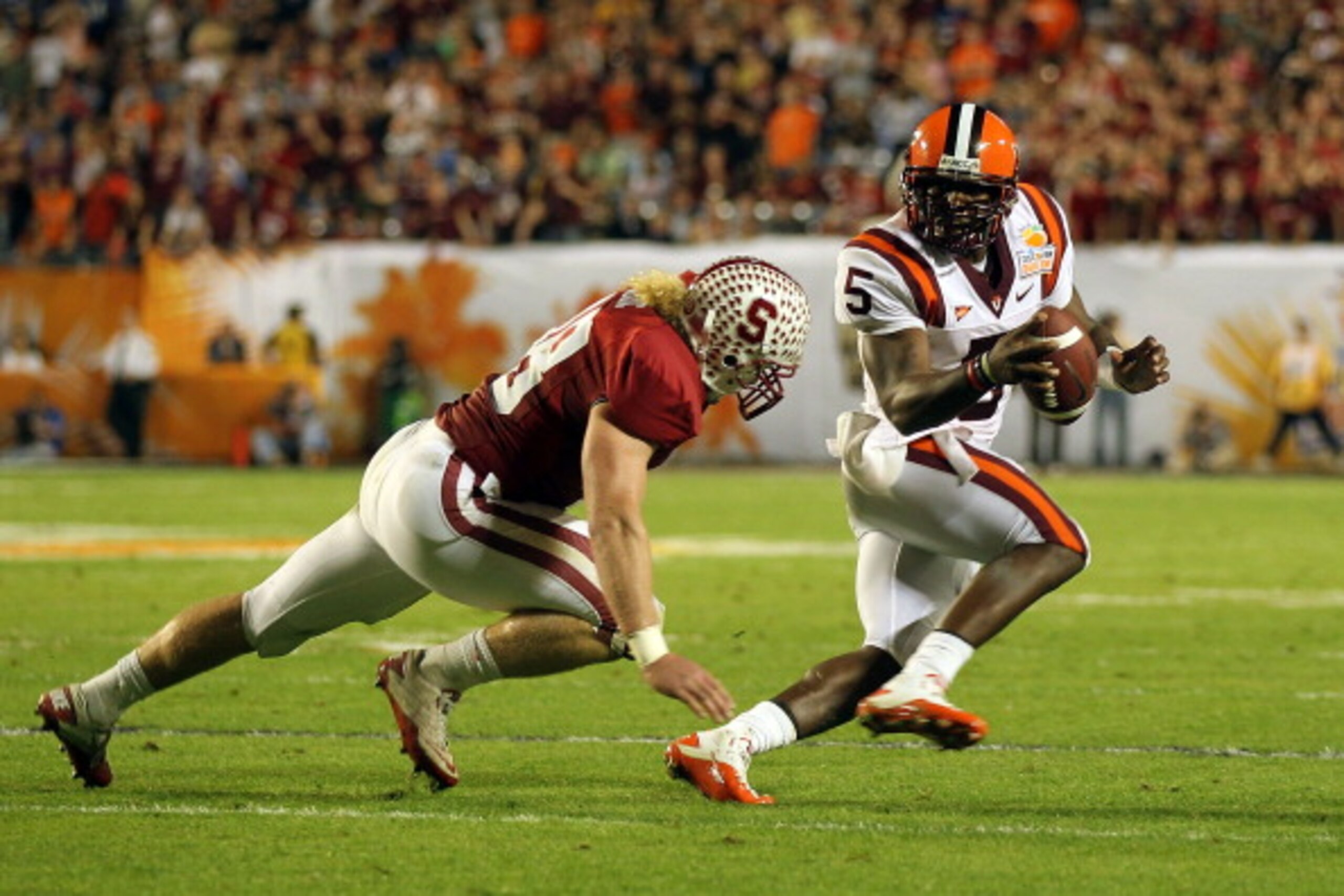 MIAMI, FL - JANUARY 03: Tyrod Taylor #5 of the Virginia Tech Hokies attempts to avoid the pass rush by Owen Marecic #48 of the Stanford Cardinal during the 2011 Discover Orange Bowl at Sun Life Stadium on January 3, 2011 in Miami, Florida. Stanford won 4 MIAMI, FL - JANUARY 03: Tyrod Taylor #5 of the Virginia Tech Hokies attempts to avoid the pass rush by Owen Marecic #48 of the Stanford Cardinal during the 2011 Discover Orange Bowl at Sun Life Stadium on January 3, 2011 in Miami, Florida. Stanford won 4