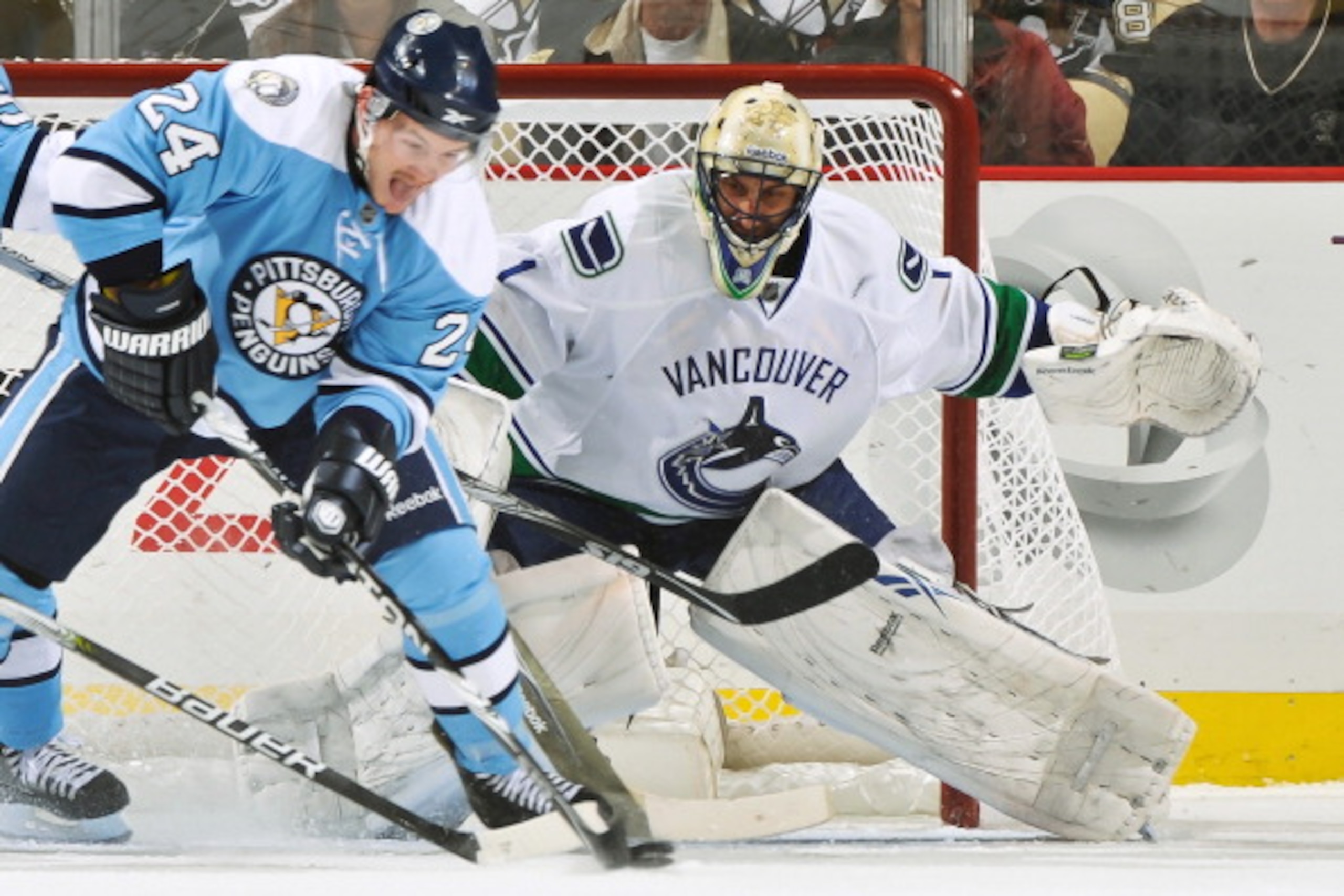 PITTSBURGH - NOVEMBER 17: Goaltender Roberto Luongo #1 of the Vancouver Canucks defends the net as Matt Cooke #24 of the Pittsburgh Penguins attempts to score on November 17, 2010 at Consol Energy Center in Pittsburgh, Pennsylvania. (Photo by Jamie Saba PITTSBURGH - NOVEMBER 17: Goaltender Roberto Luongo #1 of the Vancouver Canucks defends the net as Matt Cooke #24 of the Pittsburgh Penguins attempts to score on November 17, 2010 at Consol Energy Center in Pittsburgh, Pennsylvania. (Photo by Jamie Saba