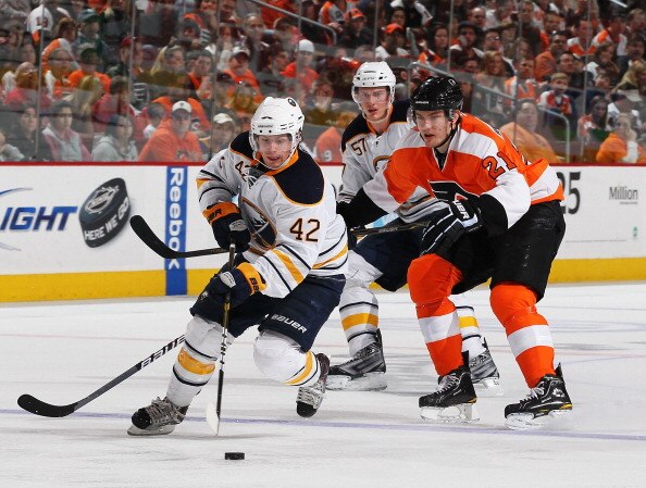 PHILADELPHIA - MARCH 05:  Nathan Gerbe #42 of the Buffalo Sabres skates with the puck as James van Riemsdyk #21  of The Philadelphia Flyers defends during their game on March 5, 2011 at The Wells Fargo Center in Philadelphia, Pennsylvania.  (Photo by Al B