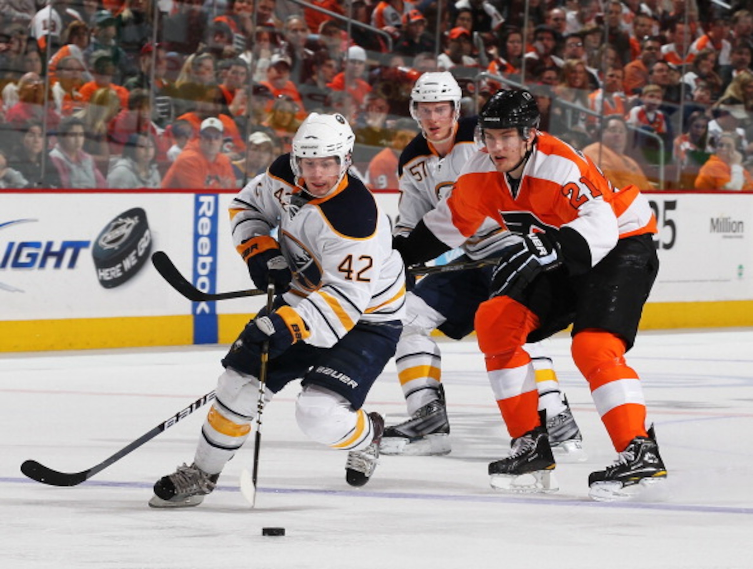 PHILADELPHIA - MARCH 05:  Nathan Gerbe #42 of the Buffalo Sabres skates with the puck as James van Riemsdyk #21  of The Philadelphia Flyers defends during their game on March 5, 2011 at The Wells Fargo Center in Philadelphia, Pennsylvania.  (Photo by Al B