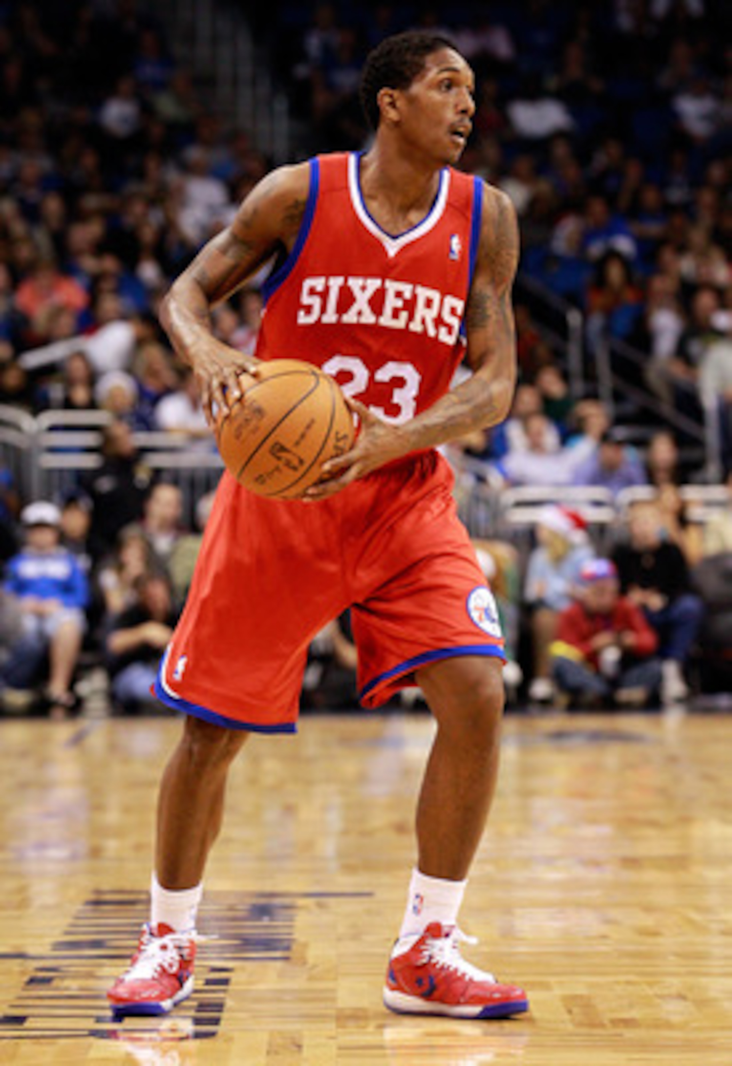 ORLANDO, FL - DECEMBER 18:  Louis Williams #23 of the Philadelphia 76ers looks to pass during the game against the Orlando Magic at Amway Arena on December 18, 2010 in Orlando, Florida.  NOTE TO USER: User expressly acknowledges and agrees that, by downlo