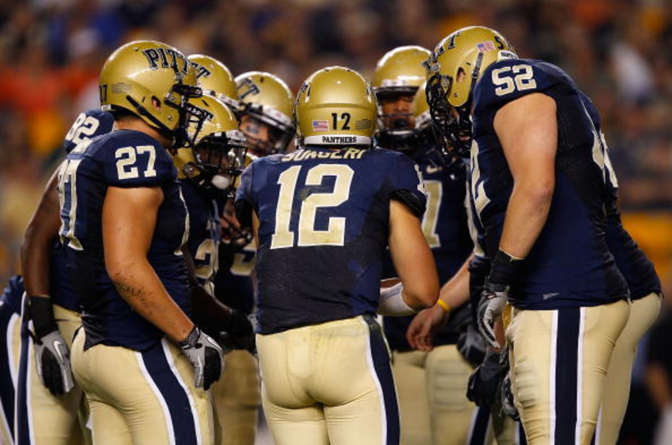 PITTSBURGH - SEPTEMBER 23:  Tino Sunseri #12 of the Pittsburgh Panthers calls a play in the huddle during the game against the Miami Hurricanes on September 23, 2010 at Heinz Field in Pittsburgh, Pennsylvania.  (Photo by Jared Wickerham/Getty Images)