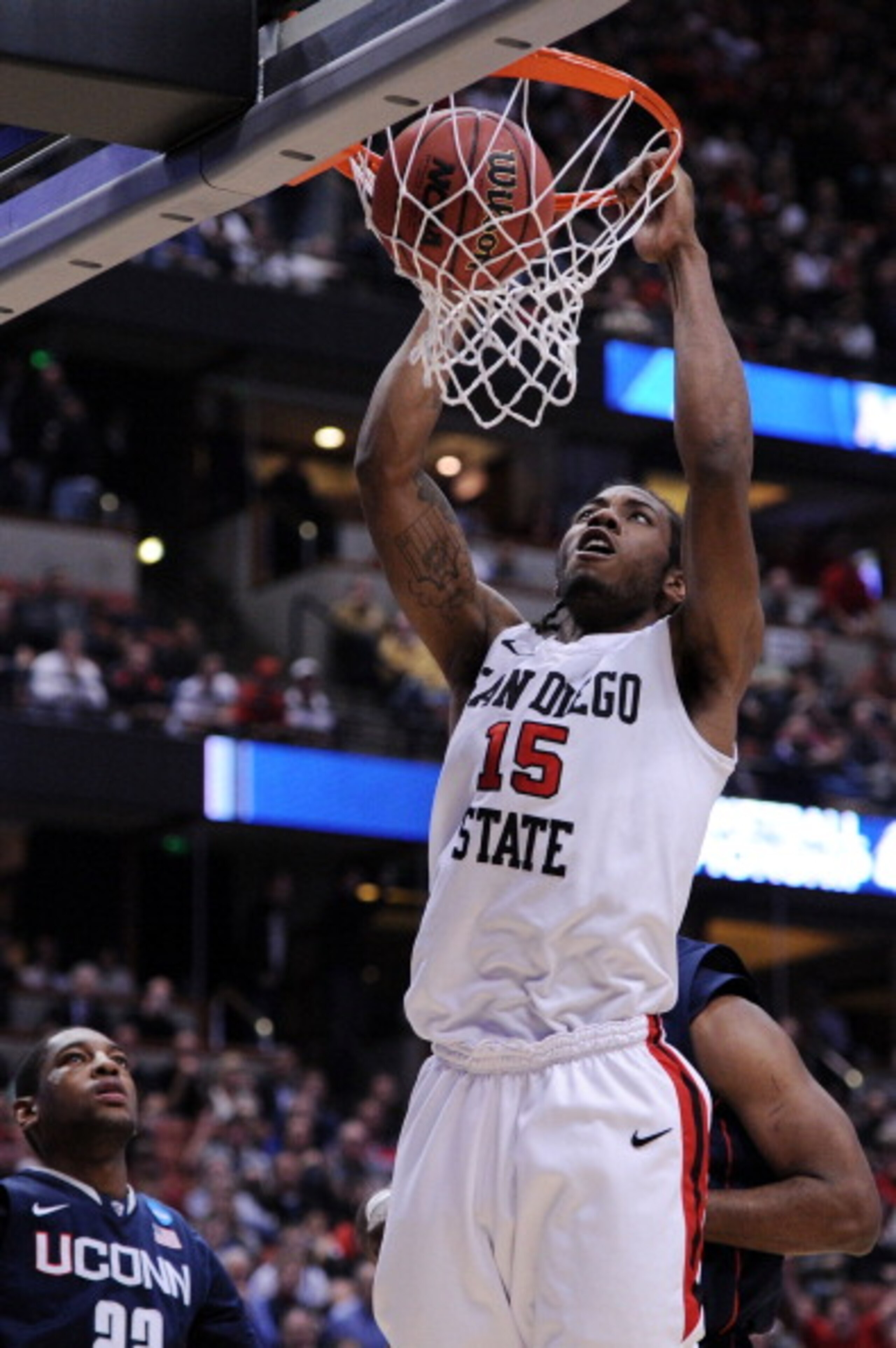 ANAHEIM, CA - MARCH 24:  Kawhi Leonard #15 of the San Diego State Aztecs dunks the ball against the Connecticut Huskies during the west regional semifinal of the 2011 NCAA men's basketball tournament at the Honda Center on March 24, 2011 in Anaheim, Calif