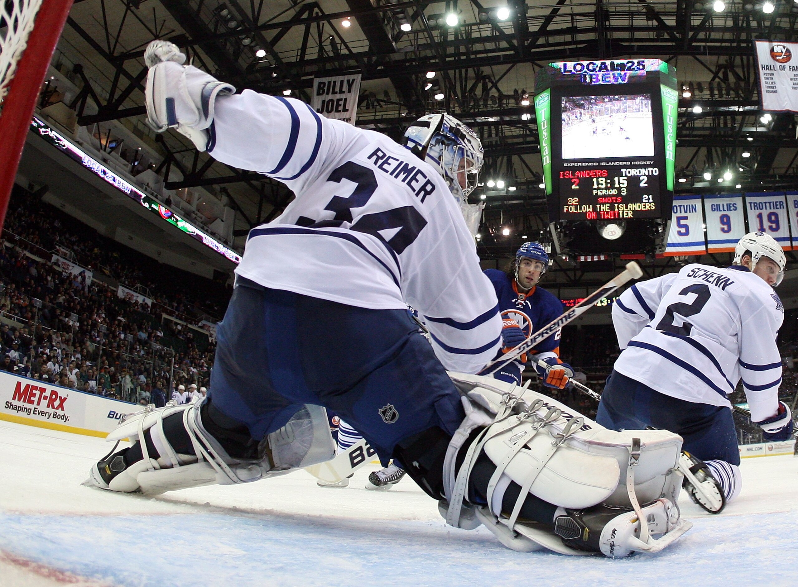UNIONDALE, NY - MARCH 08:  James Reimer #34 of the Toronto Maple Leafs tends net against the New York Islanders at the Nassau Coliseum on March 8, 2011 in Uniondale, New York. The Islanders defeated the Leafs 4-3 in overtime.  (Photo by Bruce Bennett/Gett