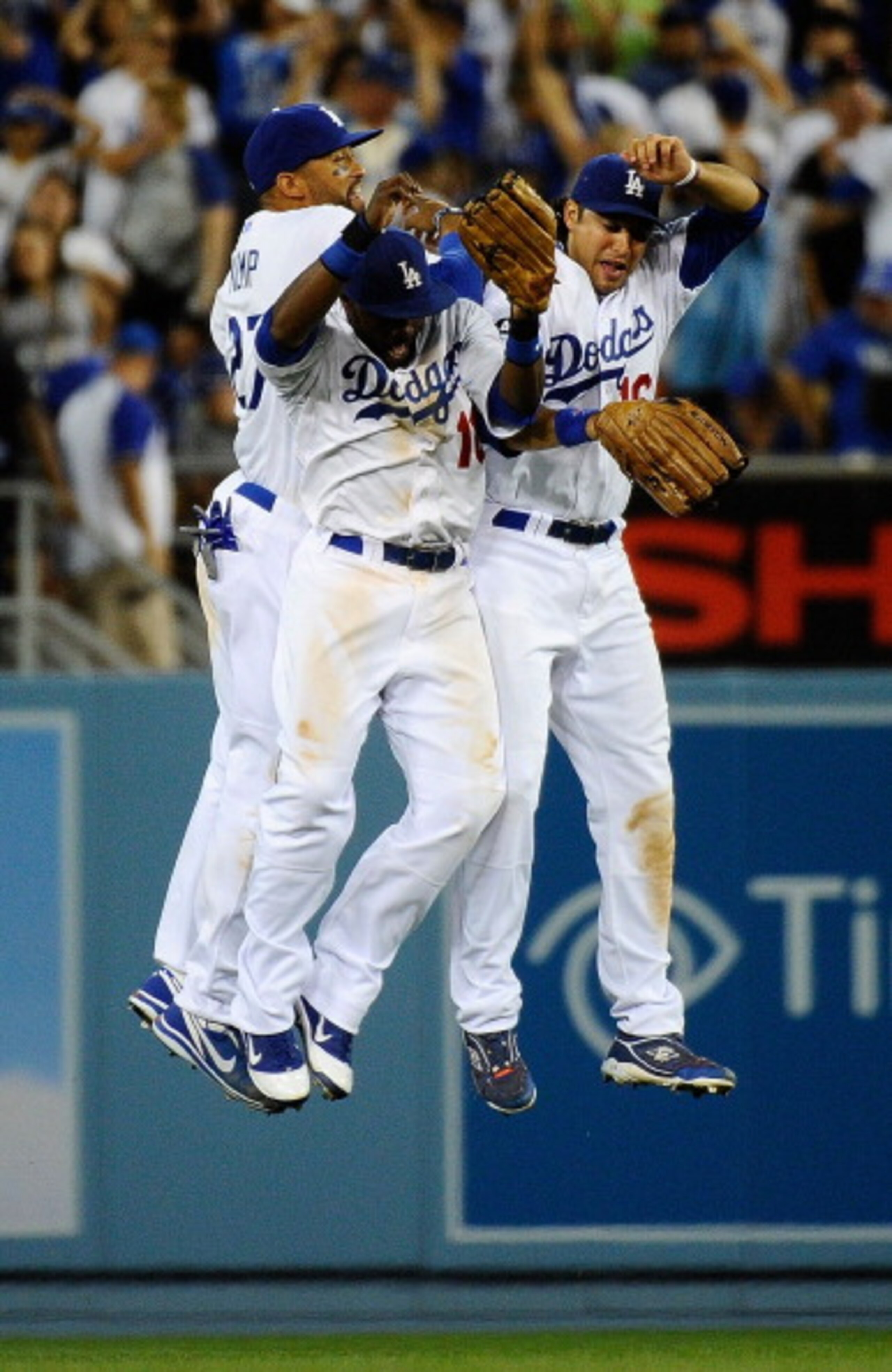 LOS ANGELES, CA - MARCH 31:  Tony Gwynn #10, Matt Kemp #27 and Andre Ethier #16 of the Los Angeles Dodgers celebrate their 2-1 win over the San Francisco Giants on Opening Day at Dodger Stadium on March 31, 2011 in Los Angeles, California.  (Photo by Kevo