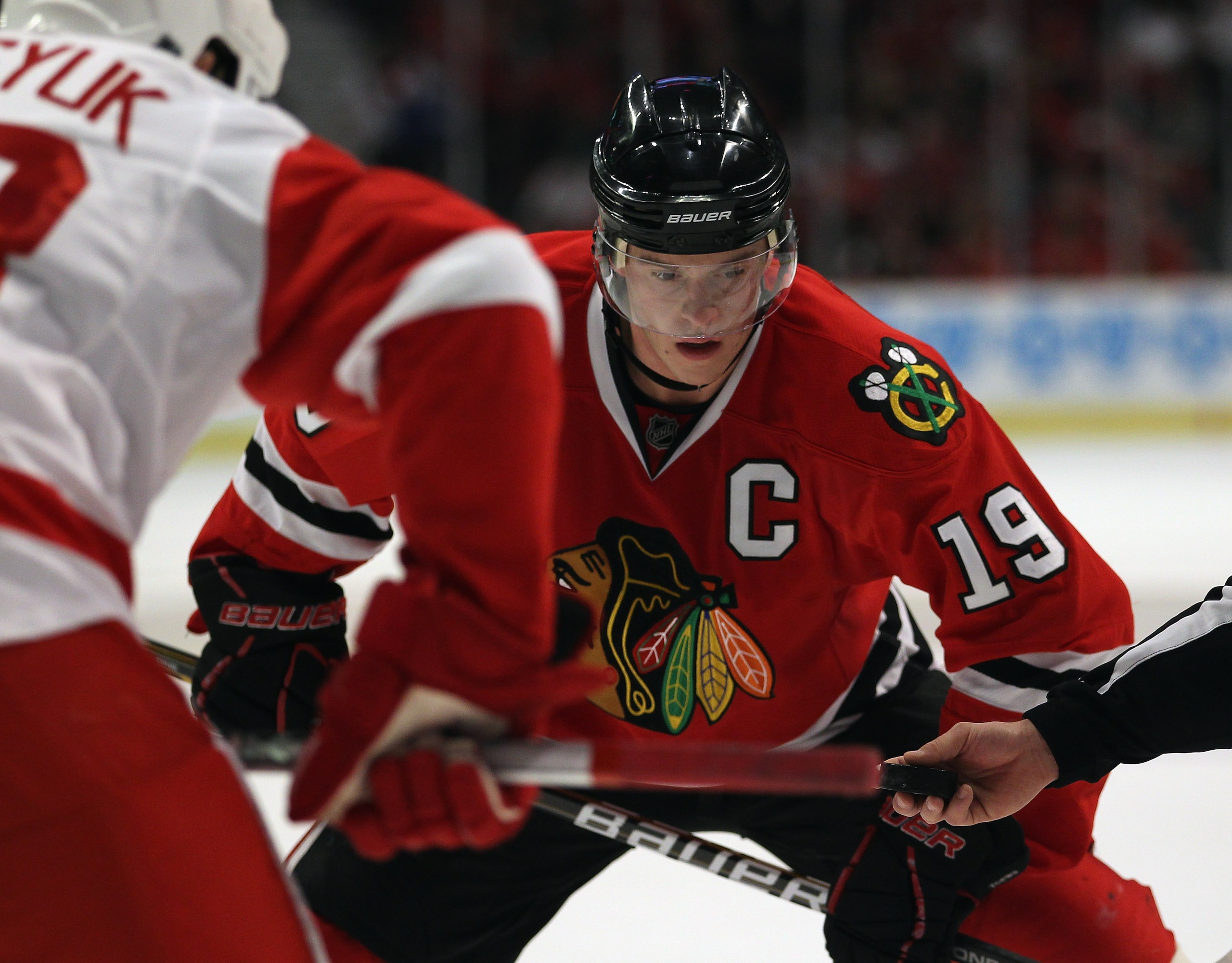 CHICAGO, IL - APRIL 10: Jonathan Toews #19 of the Chicago Blackhawks awaits a face-off against the Detroit Red Wings at the United Center on April 10, 2011 in Chicago, Illinois. The Red Wings defeated the Blackhawks 4-3 (Photo by Jonathan Daniel/Getty Im CHICAGO, IL - APRIL 10: Jonathan Toews #19 of the Chicago Blackhawks awaits a face-off against the Detroit Red Wings at the United Center on April 10, 2011 in Chicago, Illinois. The Red Wings defeated the Blackhawks 4-3 (Photo by Jonathan Daniel/Getty Im