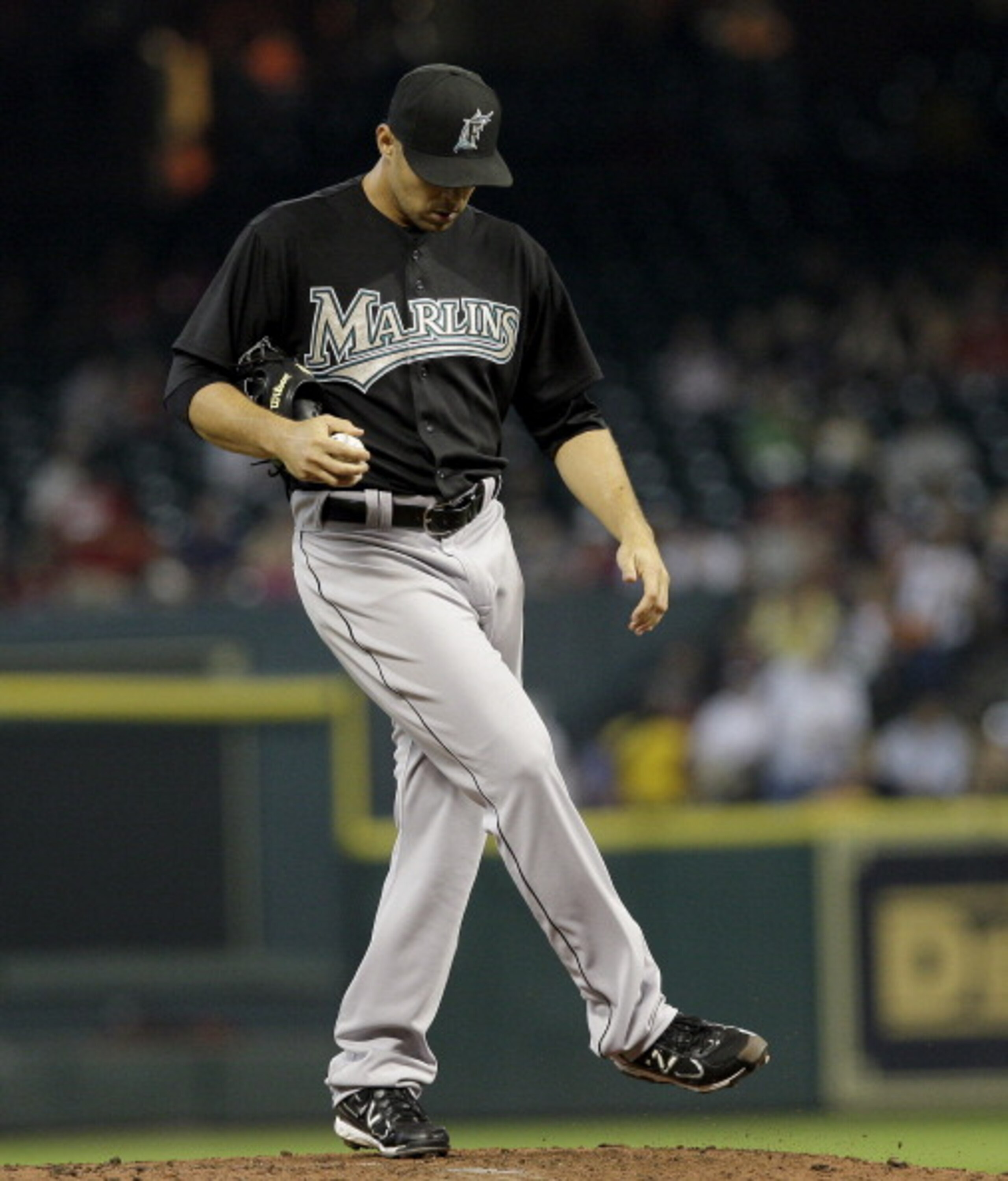 HOUSTON,TX- APRIL 9 : Pitcher Javier Vasquez #23 of the Florida Marlins kicks the mound in the third inning after giving up back to back doubles against the Houston Astros in a MLB baseball game on April 9, 2011 at Minute Maid Park in Houston, Texas. The