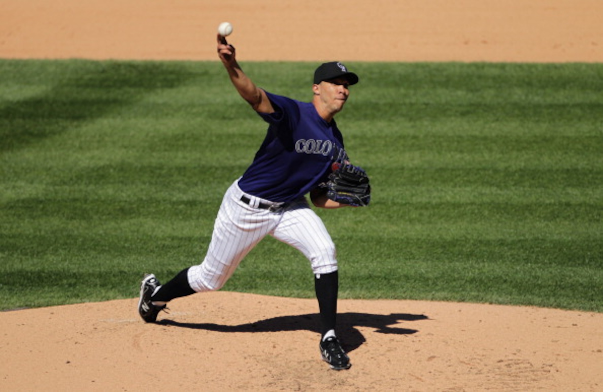 DENVER, CO - APRIL 01:  Starting pitcher Ubaldo Jimenez #38 of the Colorado Rockies delivers against the Arizona Diamondbacks during Opening Day at Coors Field on April 1, 2011 in Denver, Colorado.  (Photo by Doug Pensinger/Getty Images)