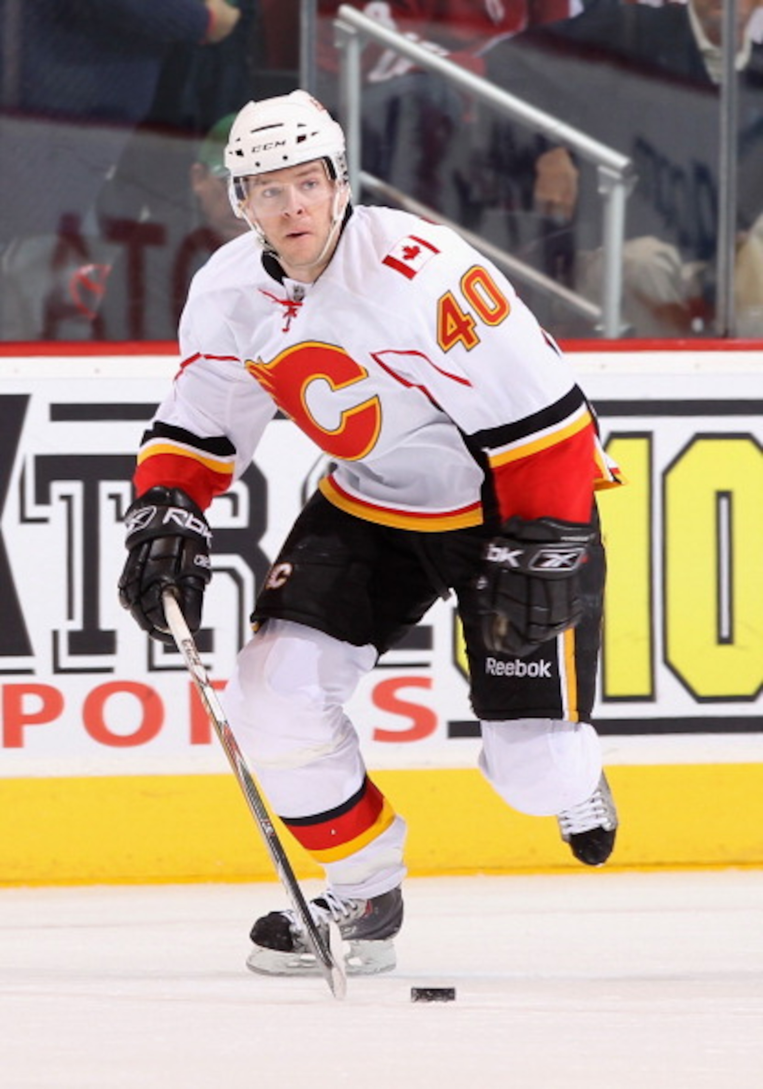 GLENDALE, AZ - MARCH 10:  Alex Tanguay #40 of the Calgary Flames skates with the puck during the NHL game against the Phoenix Coyotes at Jobing.com Arena on March 10, 2011 in Glendale, Arizona.  The Coyotes defeated the Flames 3-0.  (Photo by Christian Pe