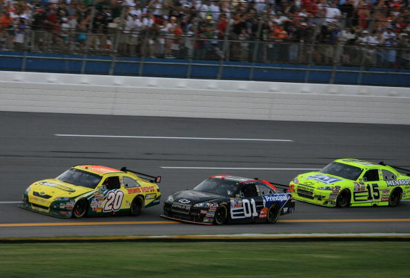 TALLADEGA, AL - OCTOBER 05:  Regan Smith driver of the #01 DEI/The Principal Financial Group Chevrolet  races Tony Stewart driver of the #20 Subway/Home Depot Toyota and Paul Menard driver of the #15 Menards/Johns Manville Chevrolet at the finish of the N