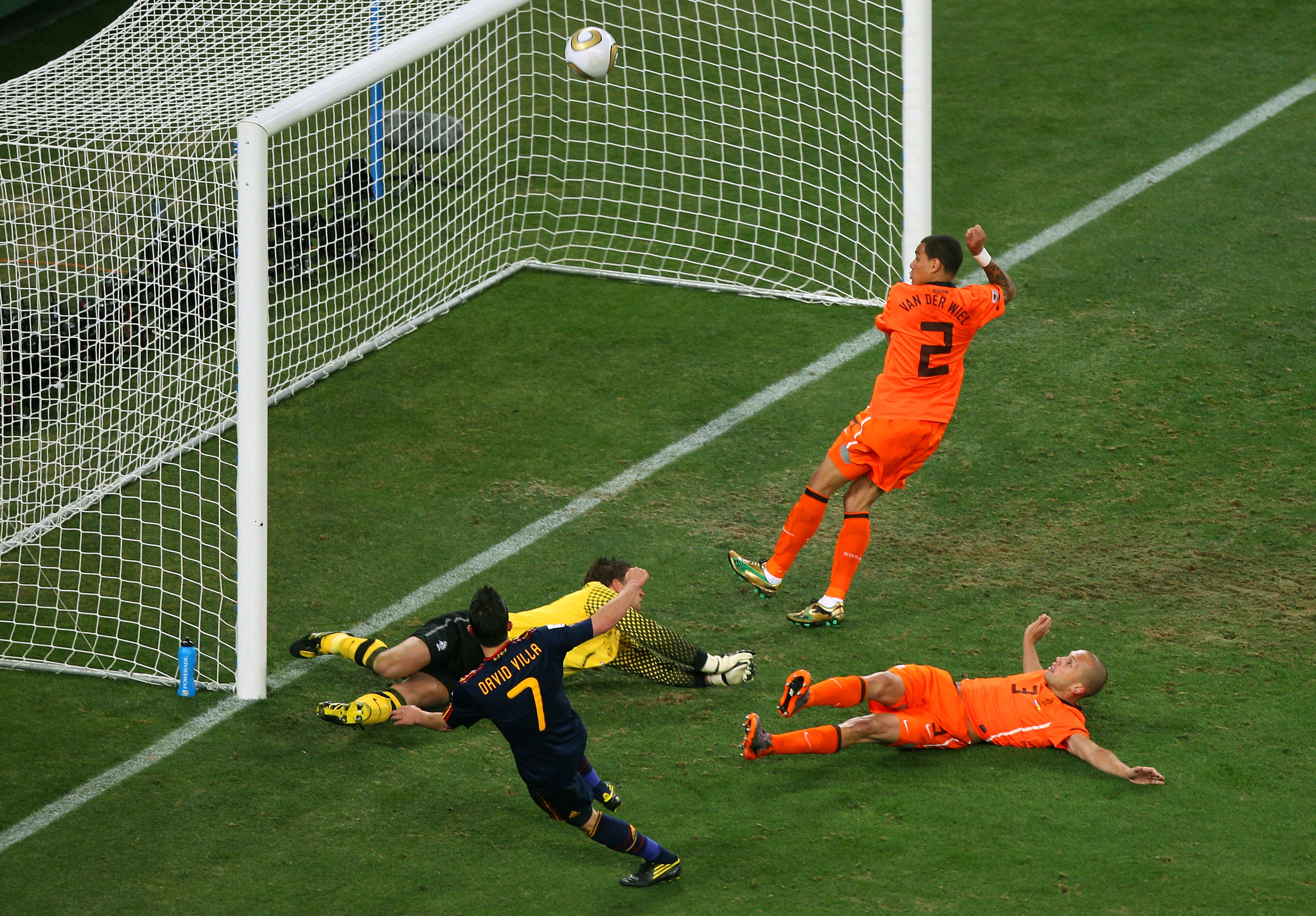 JOHANNESBURG, SOUTH AFRICA - JULY 11:  David Villa of Spain misses a goal scoring chance as goalkeeper Maarten Stekelenburg of the Netherlands dives and John Heitinga and Gregory Van Der Wiel attempt to block during the 2010 FIFA World Cup South Africa Fi