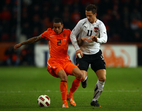 EINDHOVEN, NETHERLANDS - FEBRUARY 09:  Ory van der Wiel of The Netherlands goes past Marko Arnautovic of Austria during the International Friendly match between The Netherlands and Austria at the Phillips Stadion on February 9, 2011 in Eindhoven, Netherla