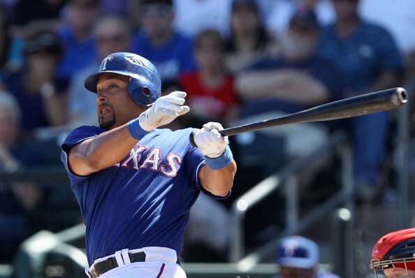 SURPRISE, AZ - MARCH 11:  Yorvit Torrealba #8 of the Texas Rangers bats against the Cincinnati Reds during the spring training game at Surprise Stadium on March 11, 2011 in Surprise, Arizona.  (Photo by Christian Petersen/Getty Images)