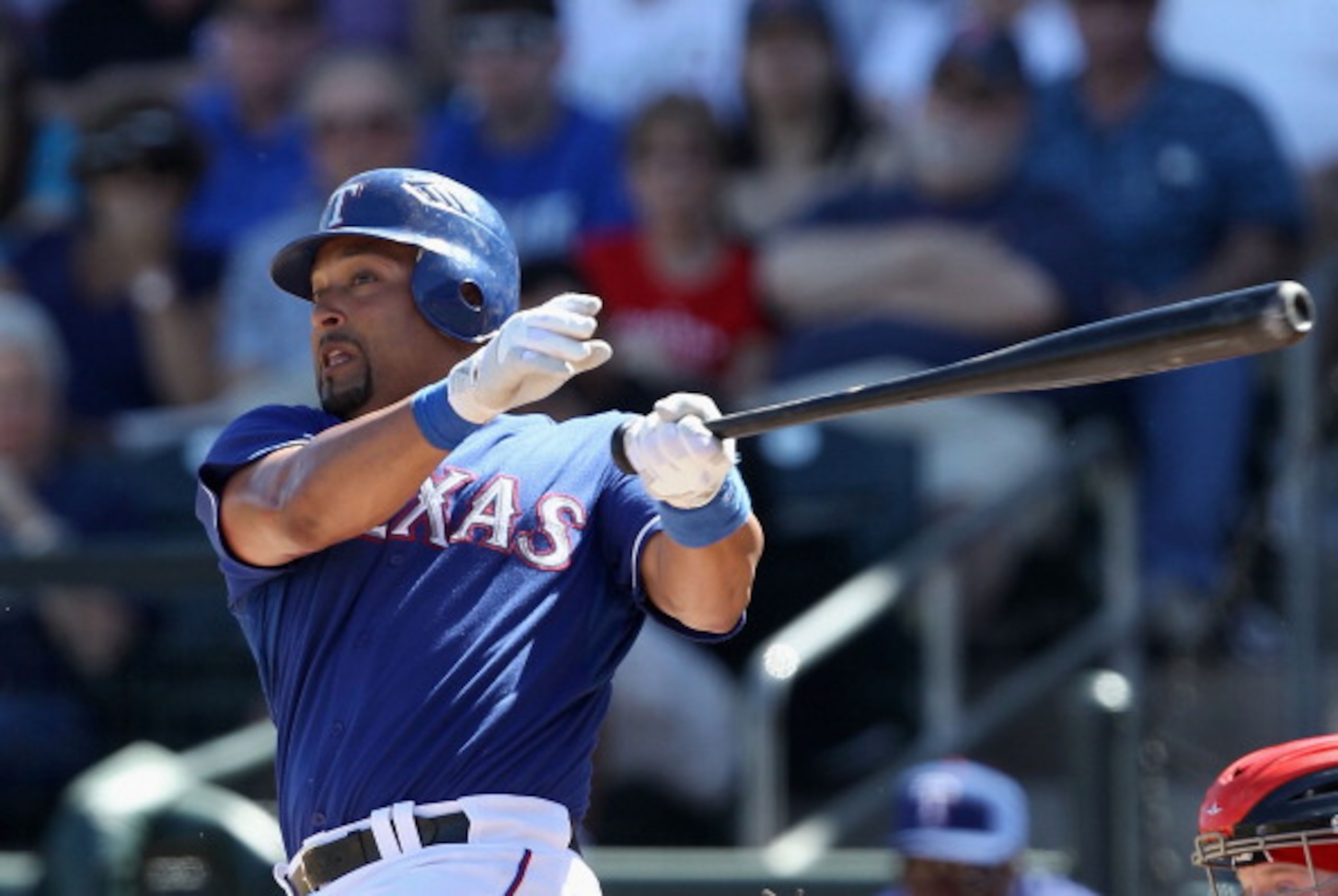 SURPRISE, AZ - MARCH 11:  Yorvit Torrealba #8 of the Texas Rangers bats against the Cincinnati Reds during the spring training game at Surprise Stadium on March 11, 2011 in Surprise, Arizona.  (Photo by Christian Petersen/Getty Images)