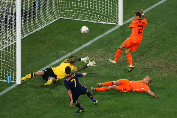 JOHANNESBURG, SOUTH AFRICA - JULY 11:  David Villa of Spain misses a goal scoring chance as goalkeeper Maarten Stekelenburg of the Netherlands dives and John Heitinga and Gregory Van Der Wiel attempt to block during the 2010 FIFA World Cup South Africa Fi