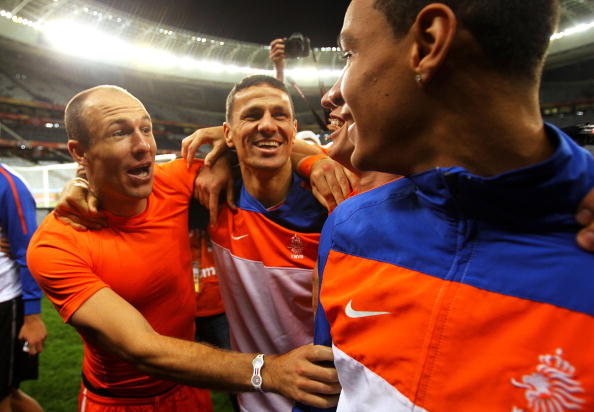 CAPE TOWN, SOUTH AFRICA - JULY 06:  Arjen Robben, Khalid Boulahrouz and Gregory Van Der Wiel of the Netherlands celebrate victory and progress to the final during the 2010 FIFA World Cup South Africa Semi Final match between Uruguay and the Netherlands at