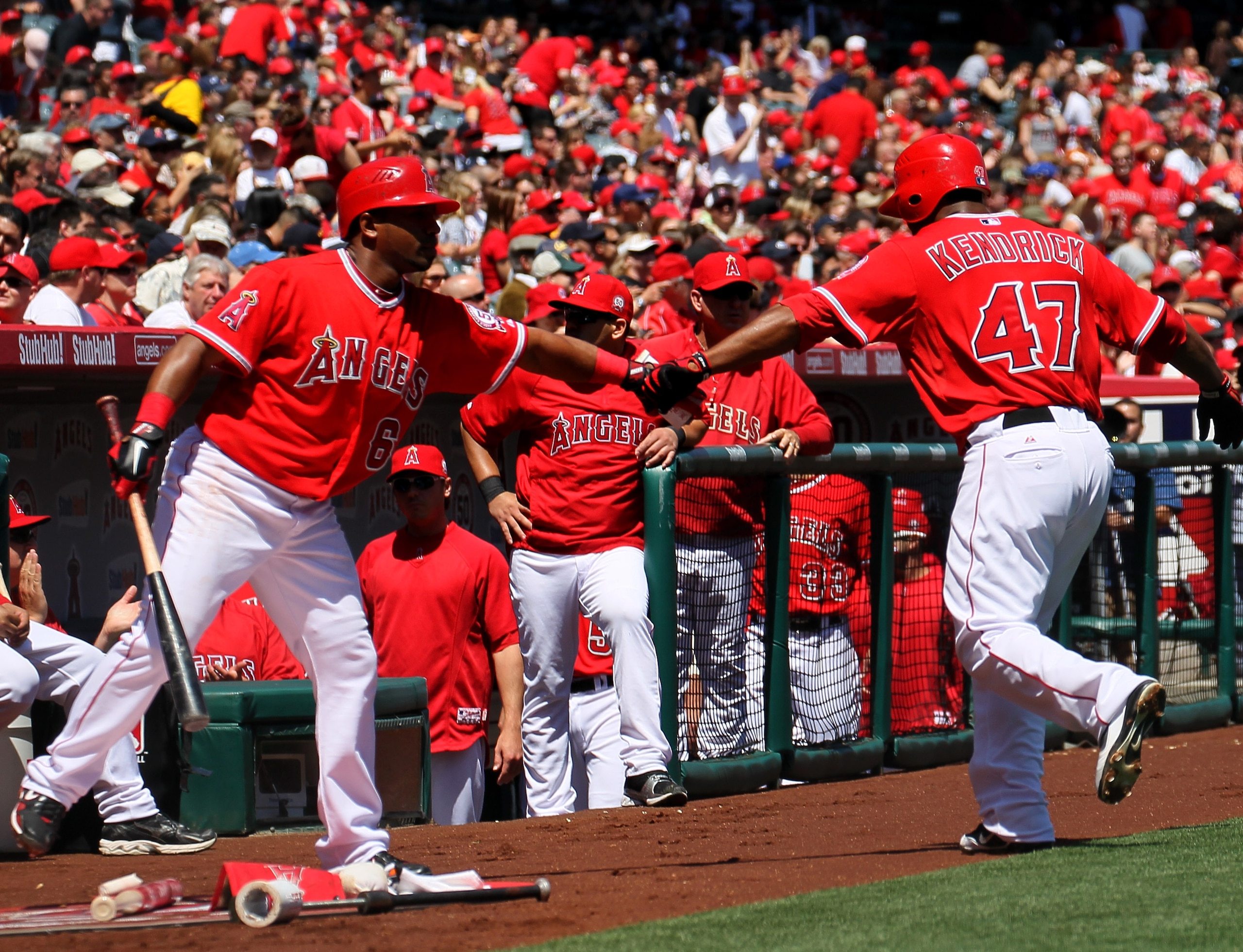 ANAHEIM, CA - APRIL 10: Howie Kendrick #47 of the Los Angeles Angels of Anaheim is greeted by Alberto Callaspo #6 after Kendrick scored a run in the first inning against the Toronto Blue Jays on April 10, 2011 at Angel Stadium in Anaheim, California. Th ANAHEIM, CA - APRIL 10: Howie Kendrick #47 of the Los Angeles Angels of Anaheim is greeted by Alberto Callaspo #6 after Kendrick scored a run in the first inning against the Toronto Blue Jays on April 10, 2011 at Angel Stadium in Anaheim, California. Th