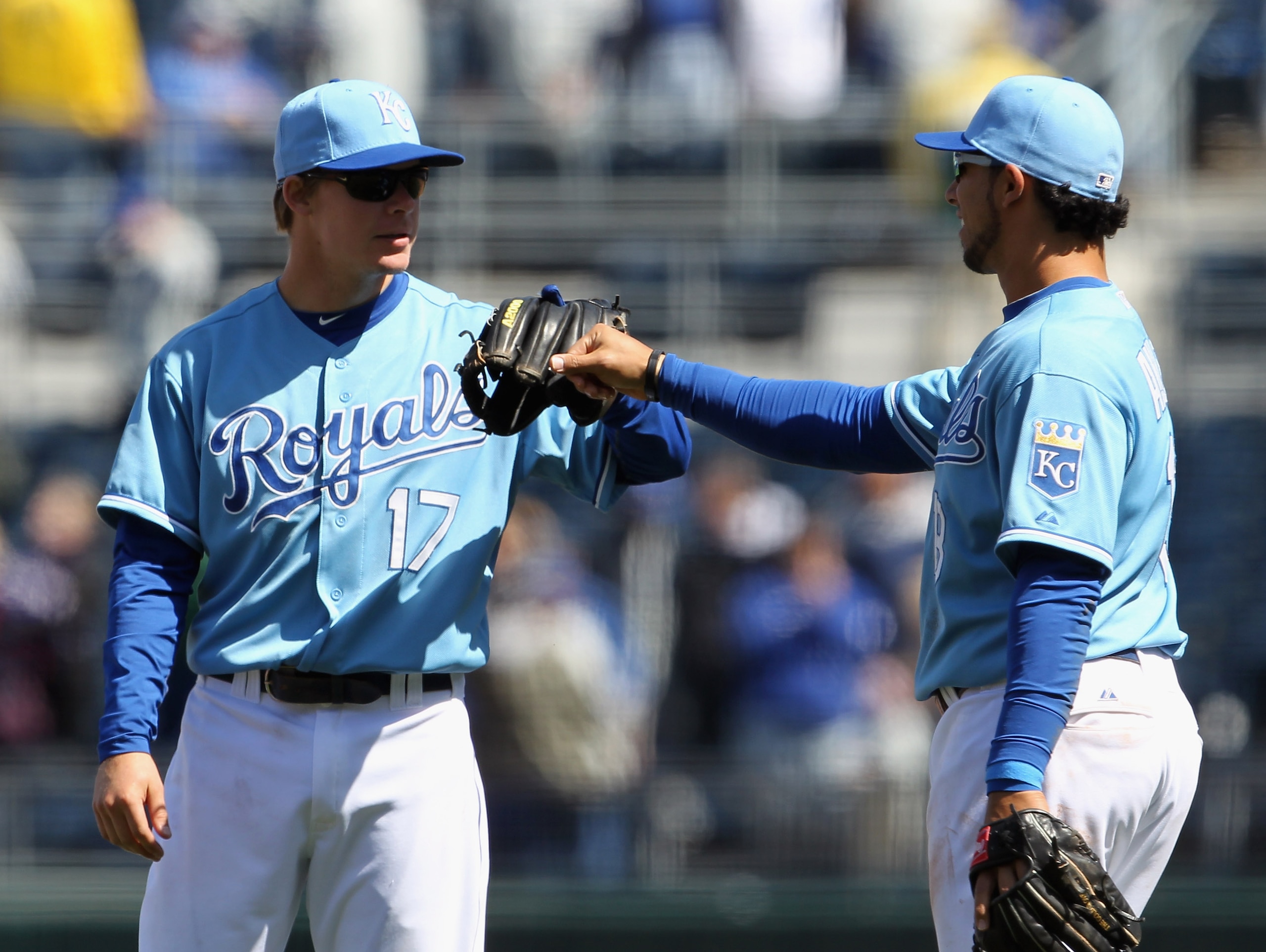KANSAS CITY, MO - APRIL 16: Chris Getz #17 and Mike Aviles #13 of the Kansas City Royals celebrate after the Royals defeated the Seattle Mariners 7-0 to win the game on April 16, 2011 at Kauffman Stadium in Kansas City, Missouri. (Photo by Jamie Squire/ KANSAS CITY, MO - APRIL 16: Chris Getz #17 and Mike Aviles #13 of the Kansas City Royals celebrate after the Royals defeated the Seattle Mariners 7-0 to win the game on April 16, 2011 at Kauffman Stadium in Kansas City, Missouri. (Photo by Jamie Squire/