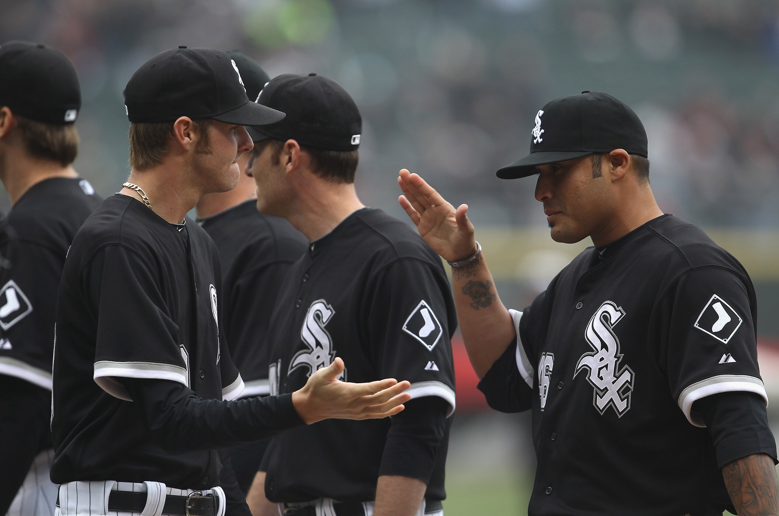 CHICAGO, IL - APRIL 07: Chris Sale #49 of the Chicago White Sox (L) is greeted by teammate Sergio Santos #46 during player introductions before the home opener against the Tampa Bay Rays at U.S. Cellular Field on April 7, 2011 in Chicago, Illinois. The Wh CHICAGO, IL - APRIL 07: Chris Sale #49 of the Chicago White Sox (L) is greeted by teammate Sergio Santos #46 during player introductions before the home opener against the Tampa Bay Rays at U.S. Cellular Field on April 7, 2011 in Chicago, Illinois. The Wh