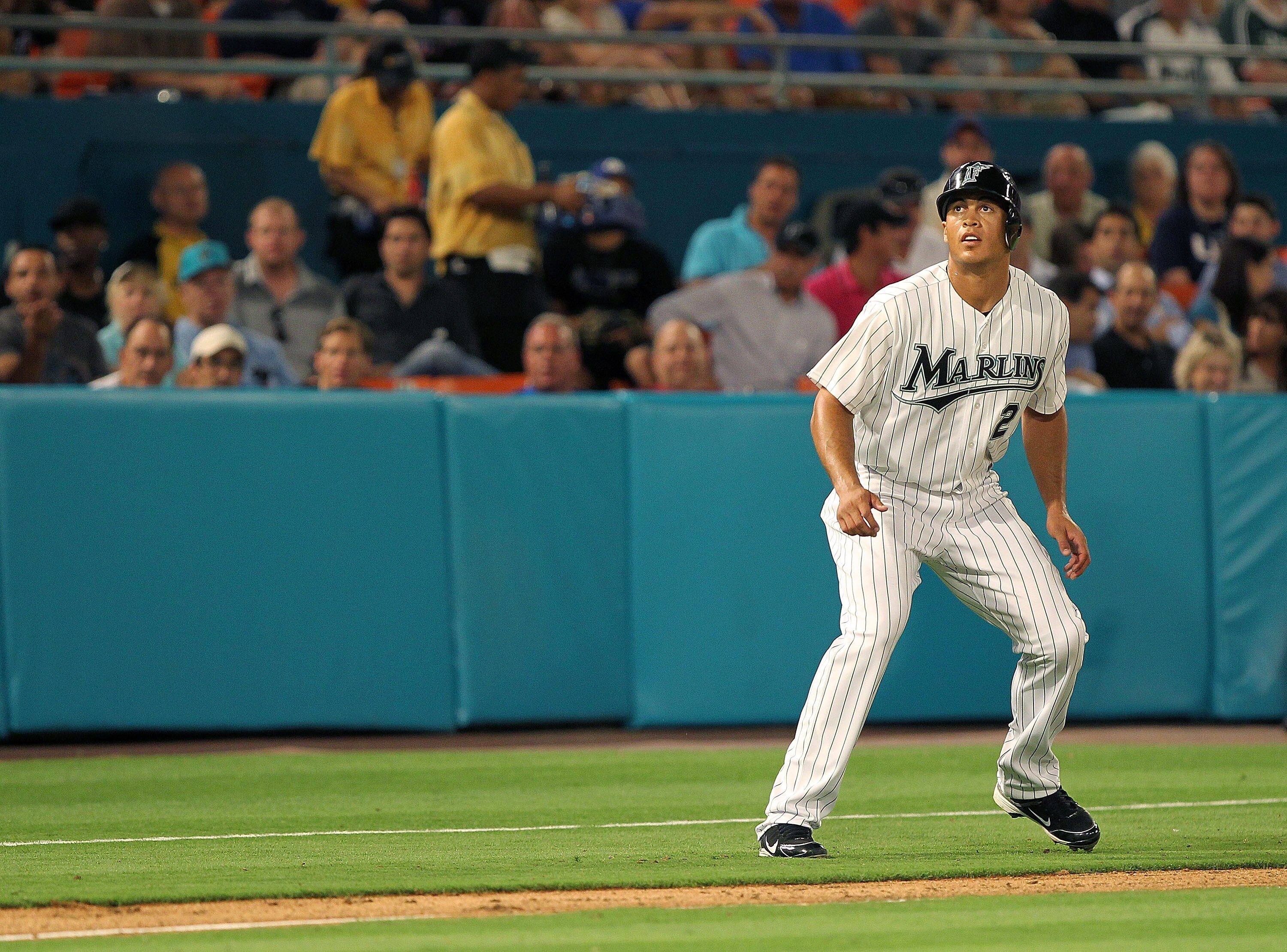 MIAMI GARDENS, FL - APRIL 01:  Mike Stanton #27 of the Florida Marlins leads off third during opening day against the New York Mets at Sun Life Stadium on April 1, 2011 in Miami Gardens, Florida.  (Photo by Mike Ehrmann/Getty Images)