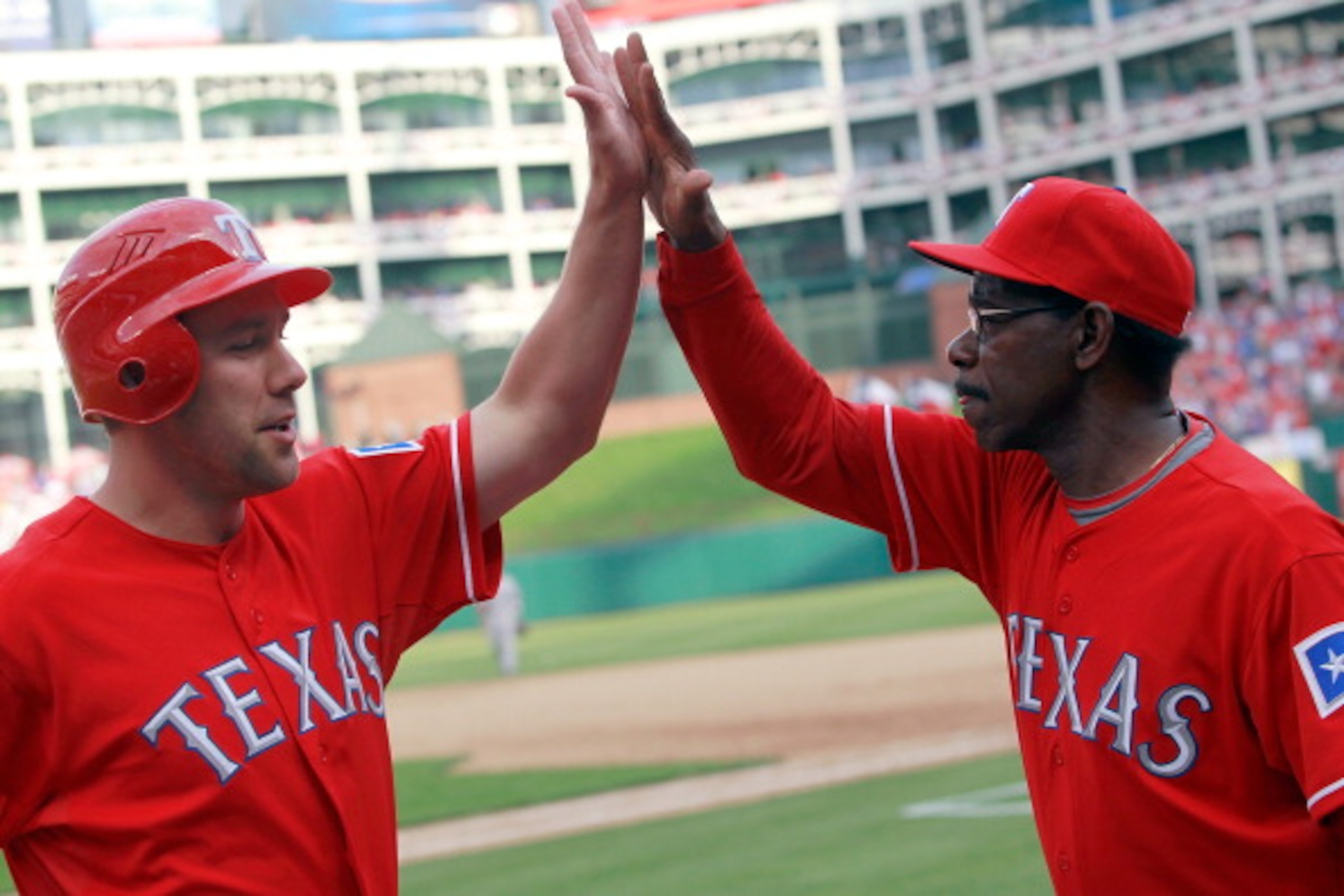ARLINGTON, TX - APRIL 01: David Murphy #7 of the Texas Rangers celebrates with Ron Washington Manager of the Texas Rangers after Hamilton hit the game winning RBI double in the bottom of the eighth inning against the Boston Red Sox on Opening Day at Rang ARLINGTON, TX - APRIL 01: David Murphy #7 of the Texas Rangers celebrates with Ron Washington Manager of the Texas Rangers after Hamilton hit the game winning RBI double in the bottom of the eighth inning against the Boston Red Sox on Opening Day at Rang