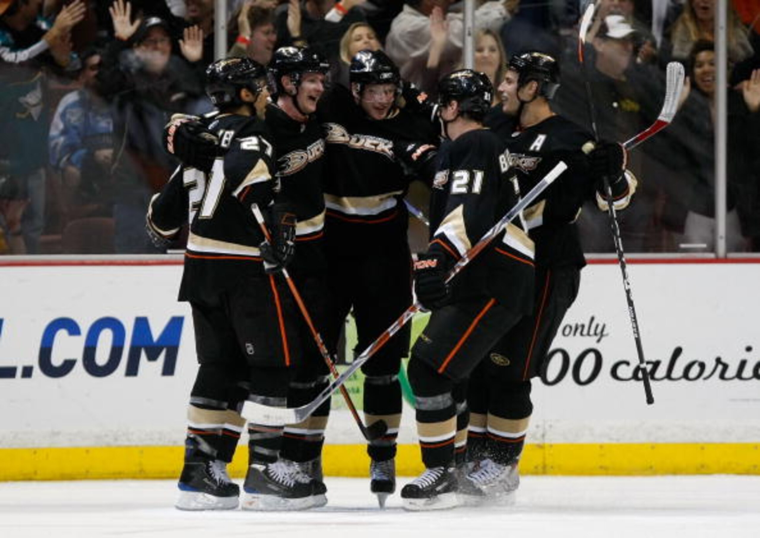 ANAHEIM, CA - NOVEMBER 03:  (L-R) Scott Niedermayer #27, Corey Perry #10, Bobby Ryan #9, Sheldon Brookbank #21 and Ryan Getzlaf #15 of the Anaheim Ducks celebrate Perry's second period goal against the Pittsburgh Penguins at the Honda Center on November 3