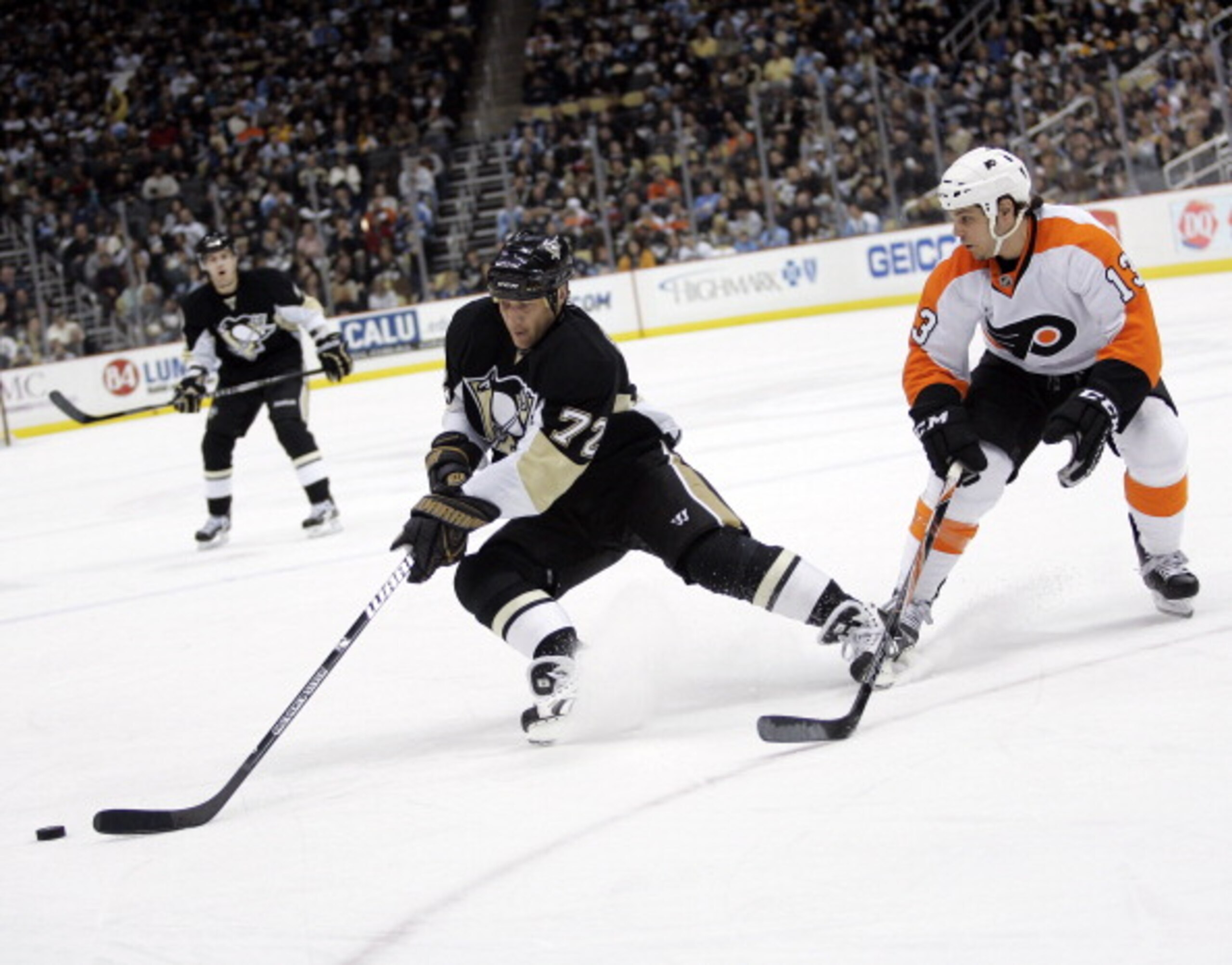 PITTSBURGH, PA - MARCH 29: Alexei Kovalev #72 of the Pittsburgh Penguins handles the puck in front of Daniel Carcillo #13 of the Philadelphia Flyers at Consol Energy Center on March 29, 2011 in Pittsburgh, Pennsylvania. (Photo by Justin K. Aller/Getty I PITTSBURGH, PA - MARCH 29: Alexei Kovalev #72 of the Pittsburgh Penguins handles the puck in front of Daniel Carcillo #13 of the Philadelphia Flyers at Consol Energy Center on March 29, 2011 in Pittsburgh, Pennsylvania. (Photo by Justin K. Aller/Getty I