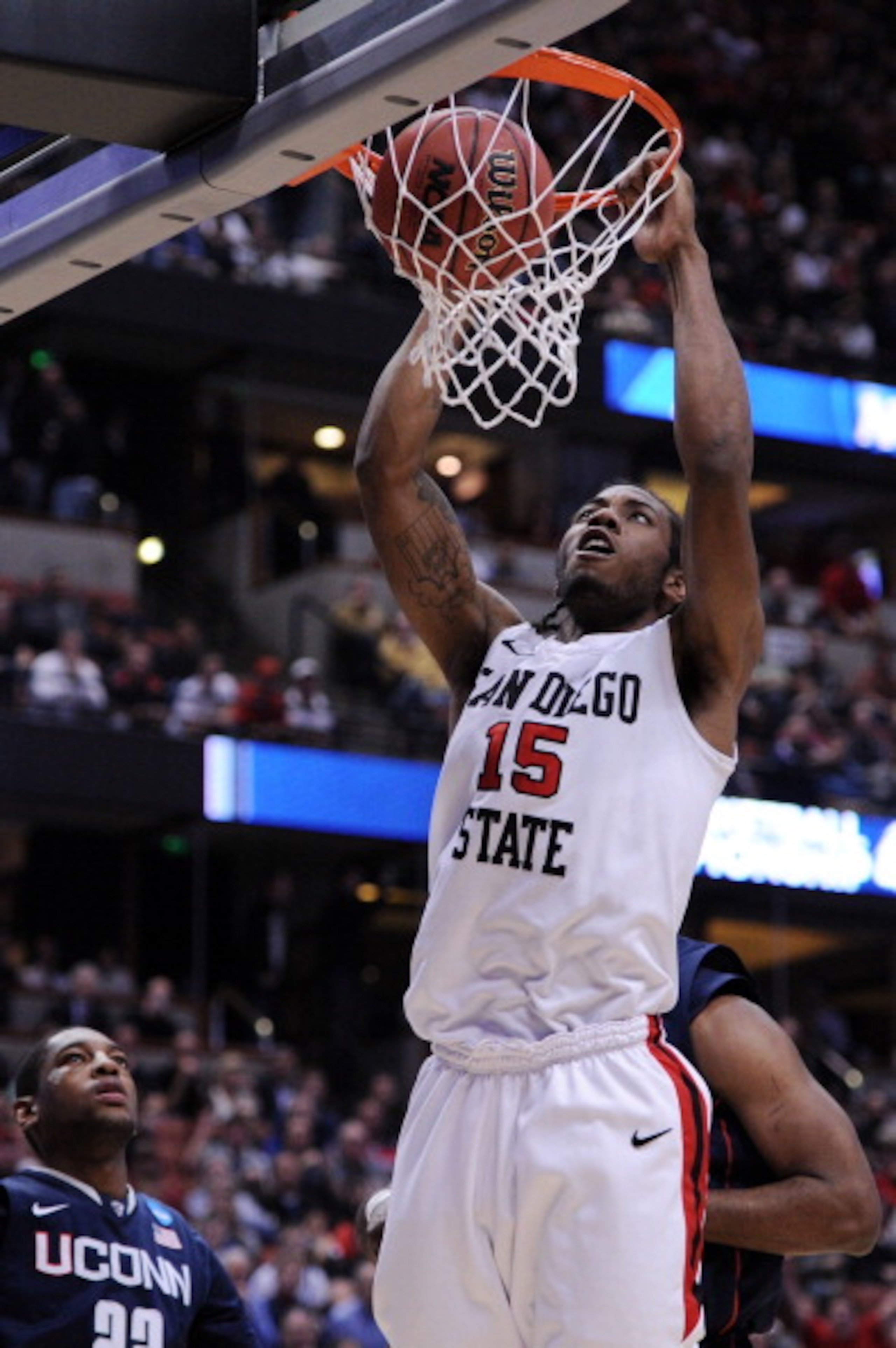 ANAHEIM, CA - MARCH 24: Kawhi Leonard #15 of the San Diego State Aztecs dunks the ball against the Connecticut Huskies during the west regional semifinal of the 2011 NCAA men's basketball tournament at the Honda Center on March 24, 2011 in Anaheim, Calif ANAHEIM, CA - MARCH 24: Kawhi Leonard #15 of the San Diego State Aztecs dunks the ball against the Connecticut Huskies during the west regional semifinal of the 2011 NCAA men's basketball tournament at the Honda Center on March 24, 2011 in Anaheim, Calif