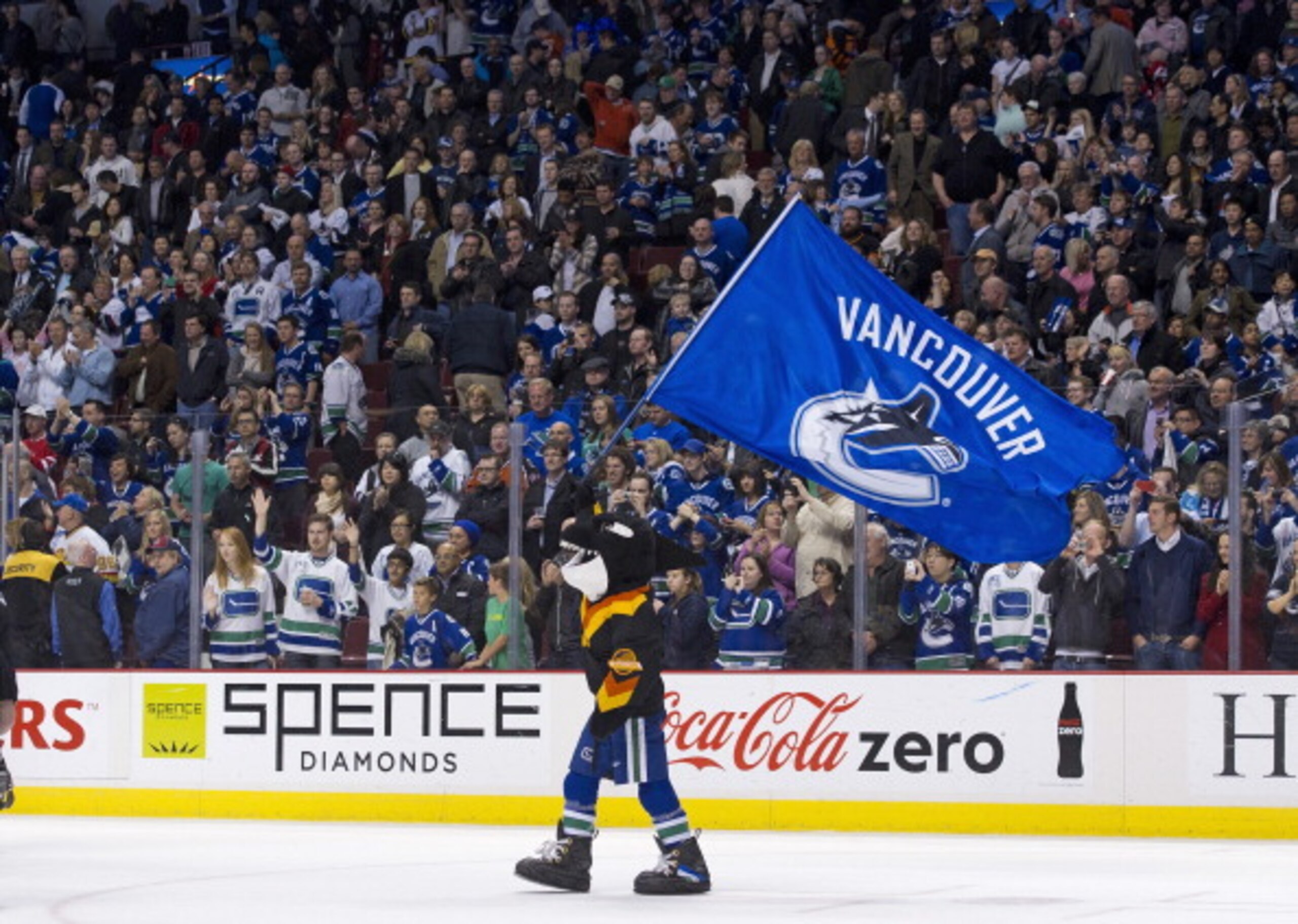 VANCOUVER, CANADA - APRIL 7: Fin, mascot of the Vancouver Canucks waves a team flag on the ice after the Vancouver Canucks defeated the Minnesota Wild in NHL action on April 07, 2011 at Rogers Arena in Vancouver, BC, Canada. (Photo by Rich Lam/Getty Imag VANCOUVER, CANADA - APRIL 7: Fin, mascot of the Vancouver Canucks waves a team flag on the ice after the Vancouver Canucks defeated the Minnesota Wild in NHL action on April 07, 2011 at Rogers Arena in Vancouver, BC, Canada. (Photo by Rich Lam/Getty Imag