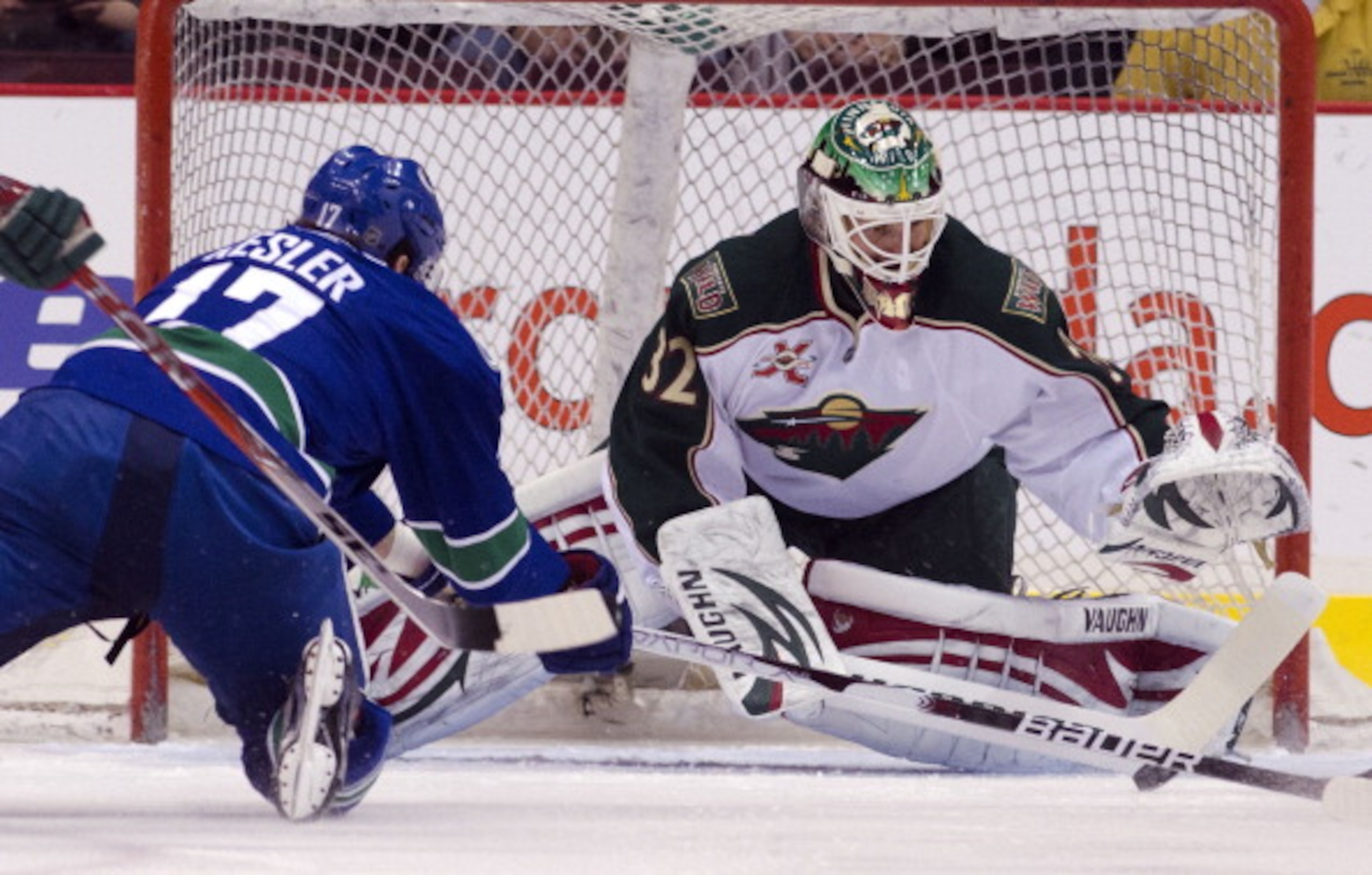 VANCOUVER, CANADA - APRIL 7: Ryan Kesler #17 of the Vancouver Canucks dives to try and shoot the puck before reaching goalie Niklas Backstrom #32 of the Minnesota Wild during the first period in NHL action on April 07, 2011 at Rogers Arena in Vancouver, B VANCOUVER, CANADA - APRIL 7: Ryan Kesler #17 of the Vancouver Canucks dives to try and shoot the puck before reaching goalie Niklas Backstrom #32 of the Minnesota Wild during the first period in NHL action on April 07, 2011 at Rogers Arena in Vancouver, B